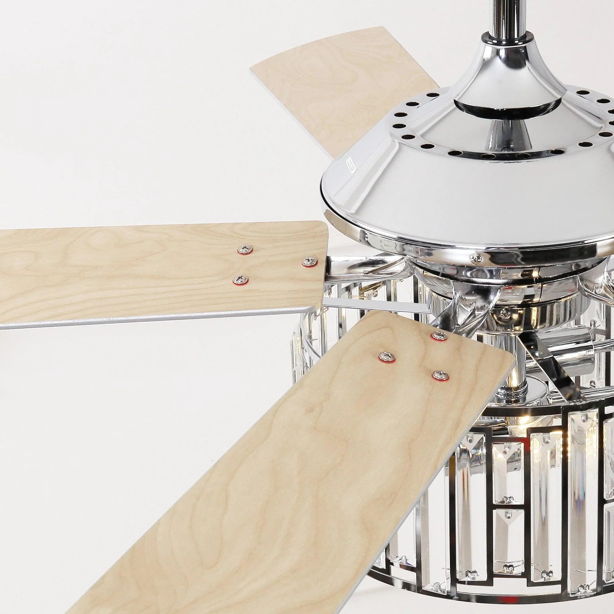 Chrome ceiling fan motor housing with light wood blades and crystal light ring