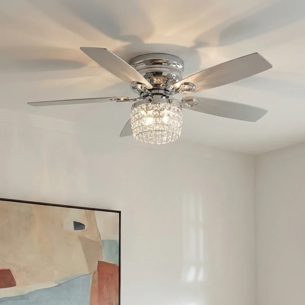 Chrome flush-mount ceiling fan with reversible blades and crystal light shade