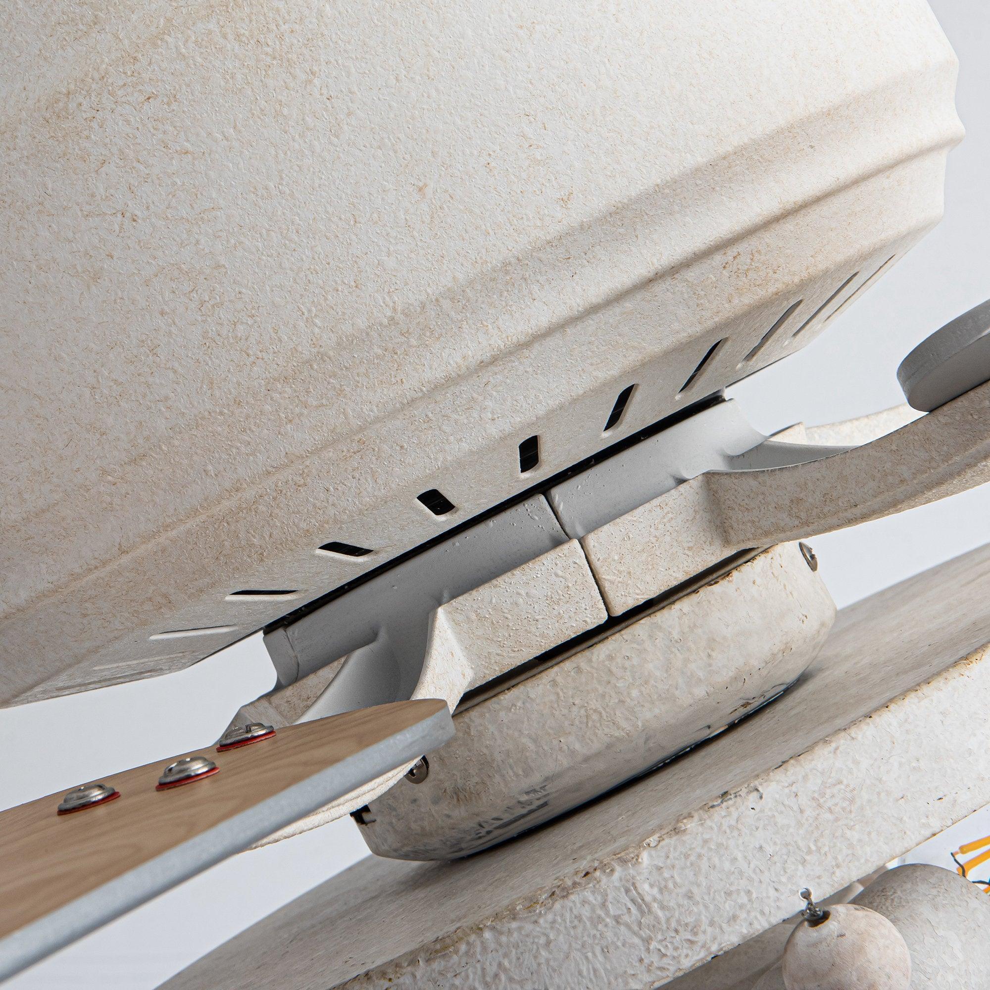 Ceiling fan flush-mount housing detail in white with blade mounting slots