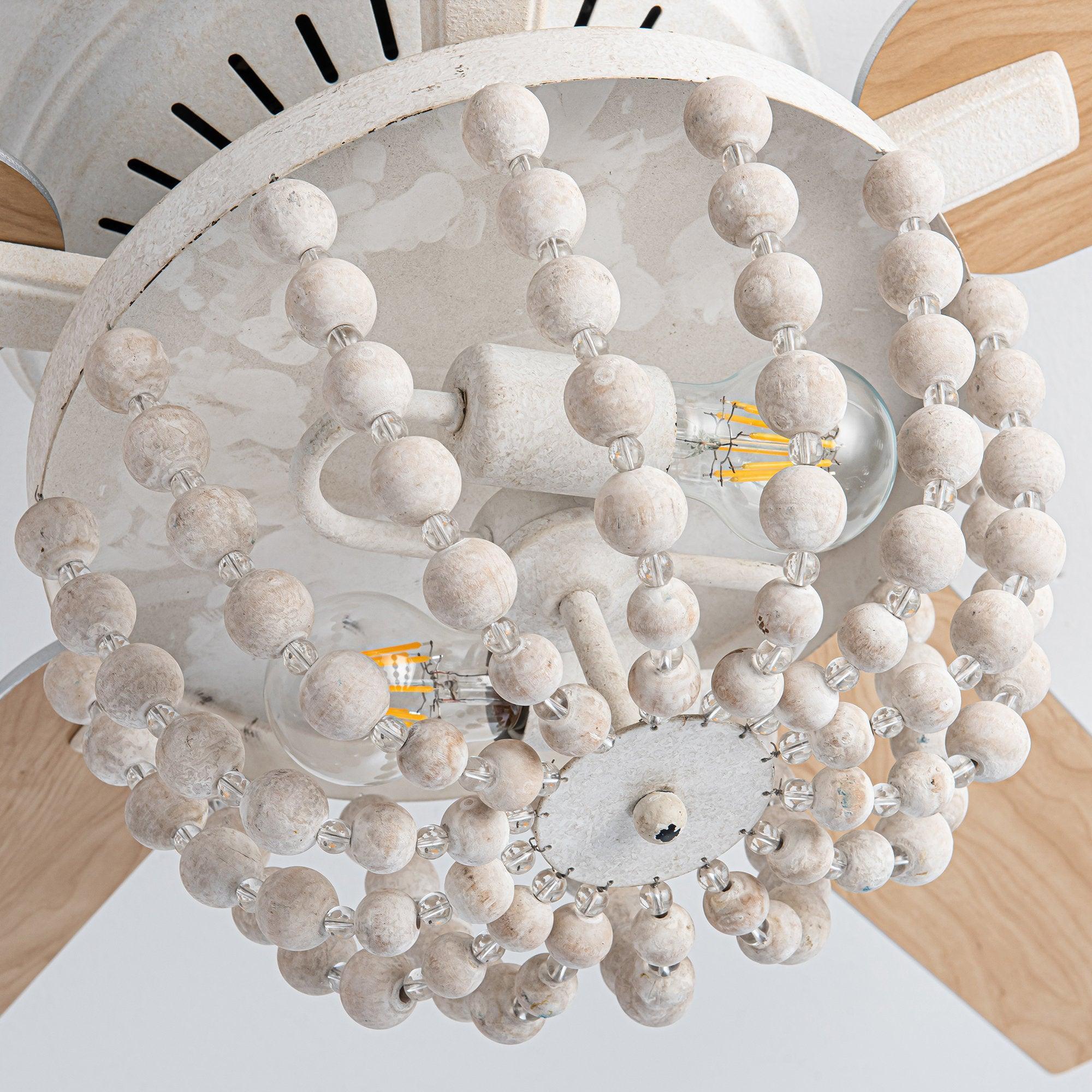 Flush mount ceiling fan with white beaded glass light shade and light wood blades