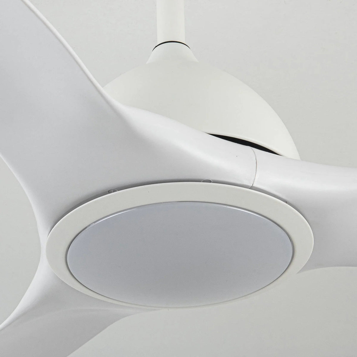 White ceiling fan with round LED light panel and smooth blade hub detail