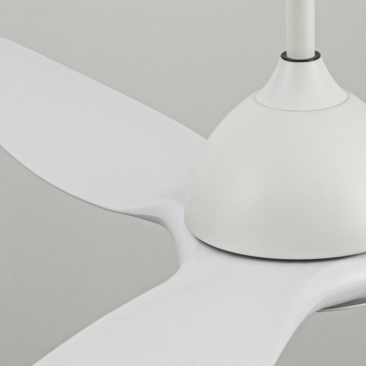 White 3-blade ceiling fan with integrated LED light, close-up view of blades