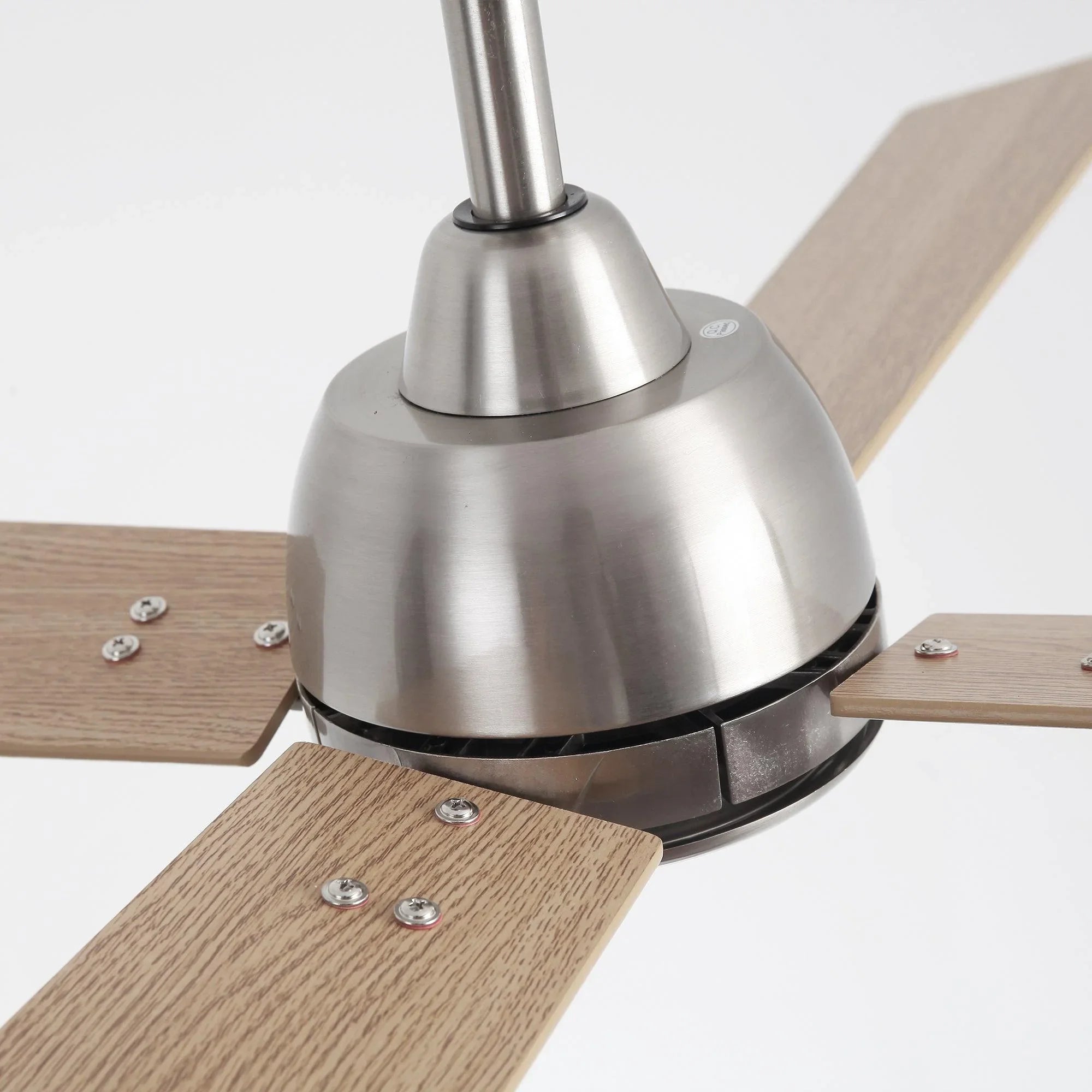Ceiling fan downrod and satin nickel motor with reversible wood-toned blades