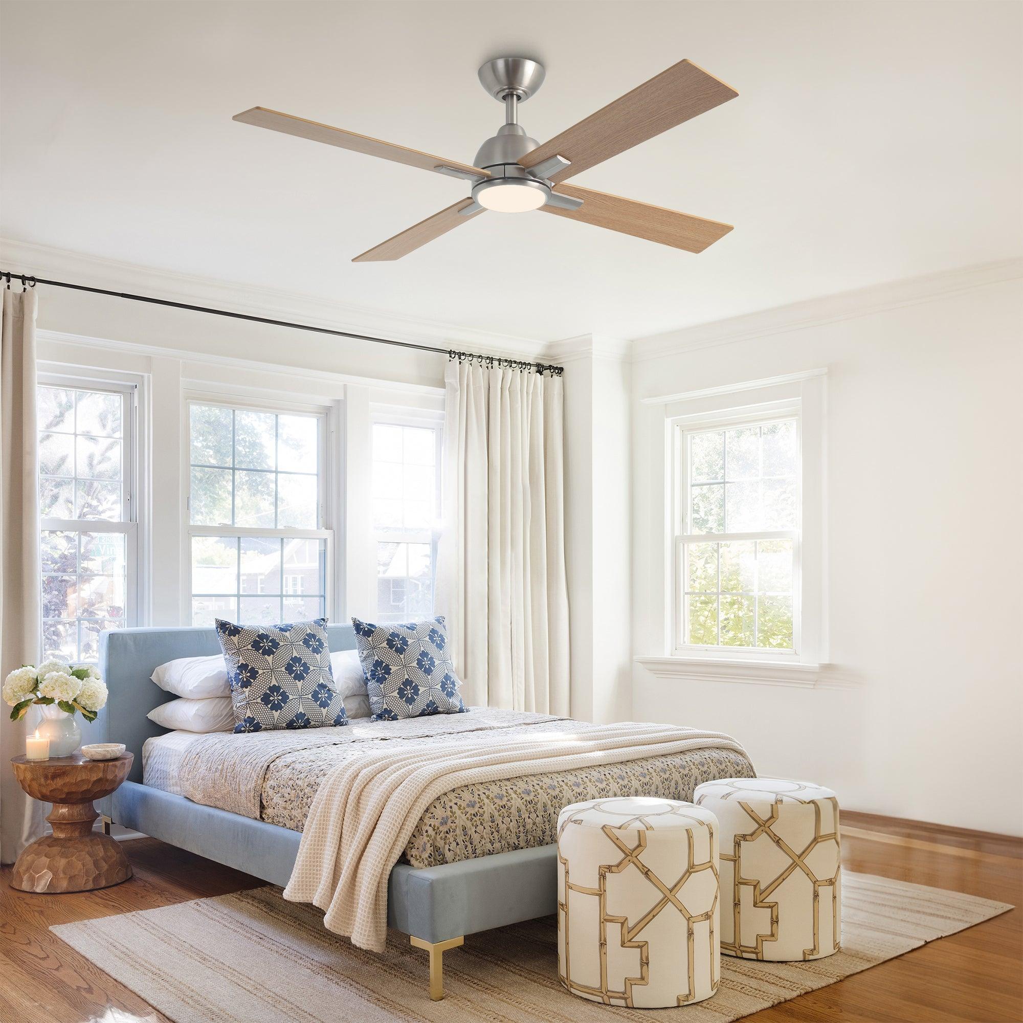 Satin nickel ceiling fan with light kit and four wood-toned reversible blades