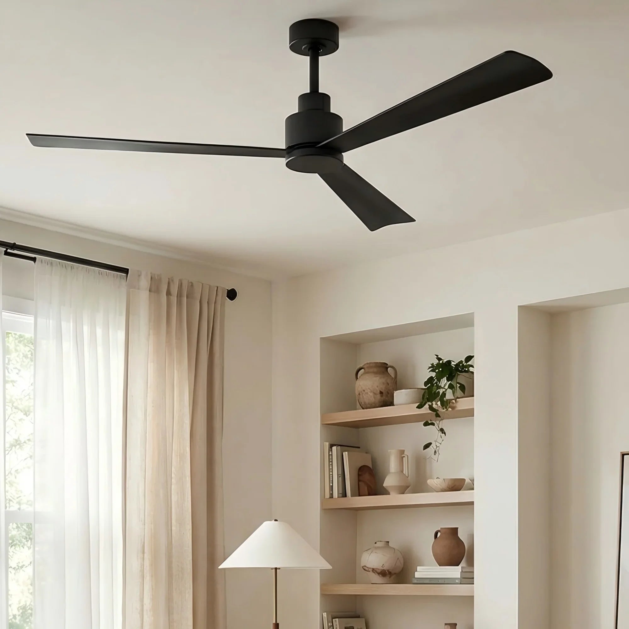 Black industrial ceiling fan with five blades on a ceiling mount