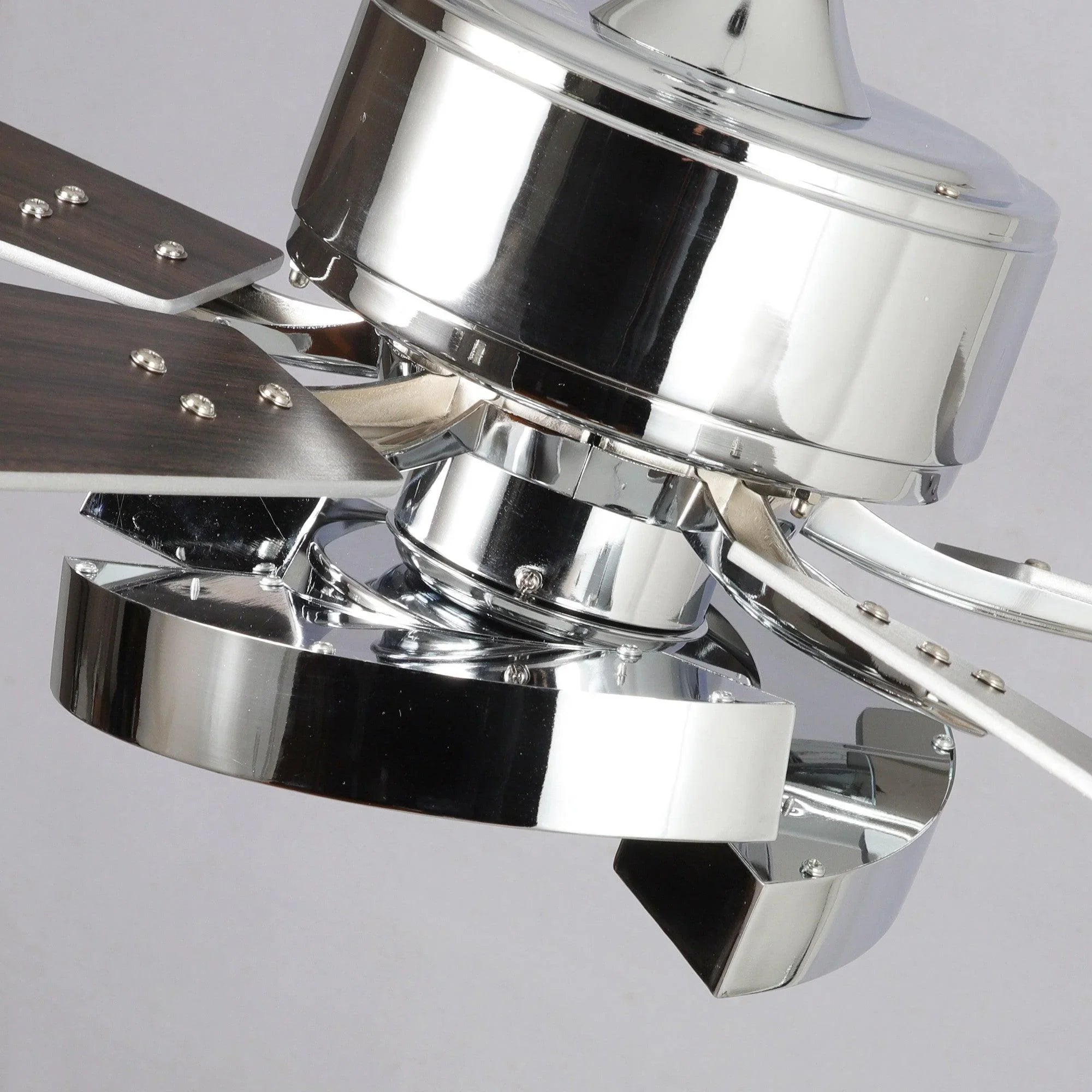 Industrial ceiling fan motor housing with polished chrome finish and mounting bracket