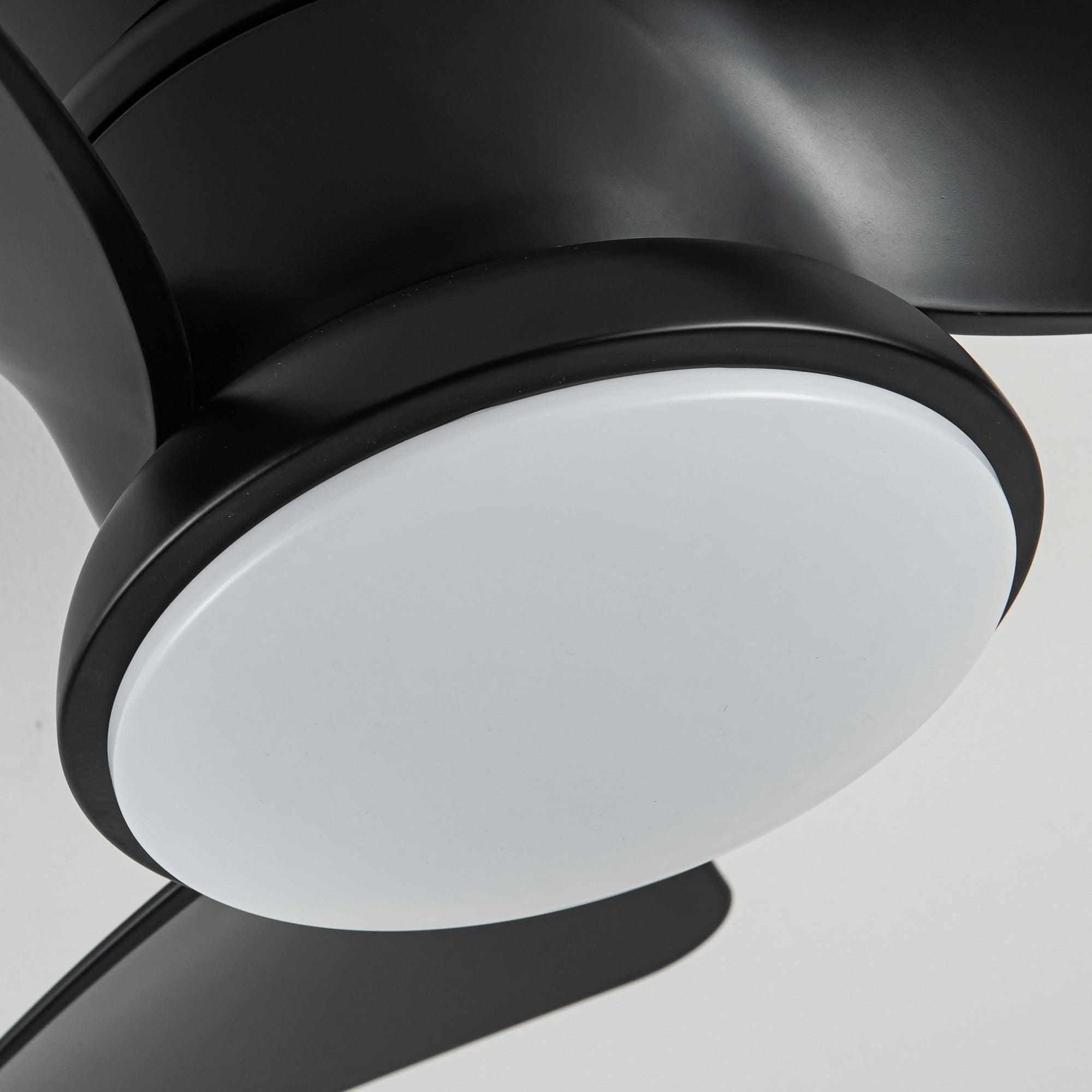 Close-up of black flush mount ceiling fan housing with round white LED light cover