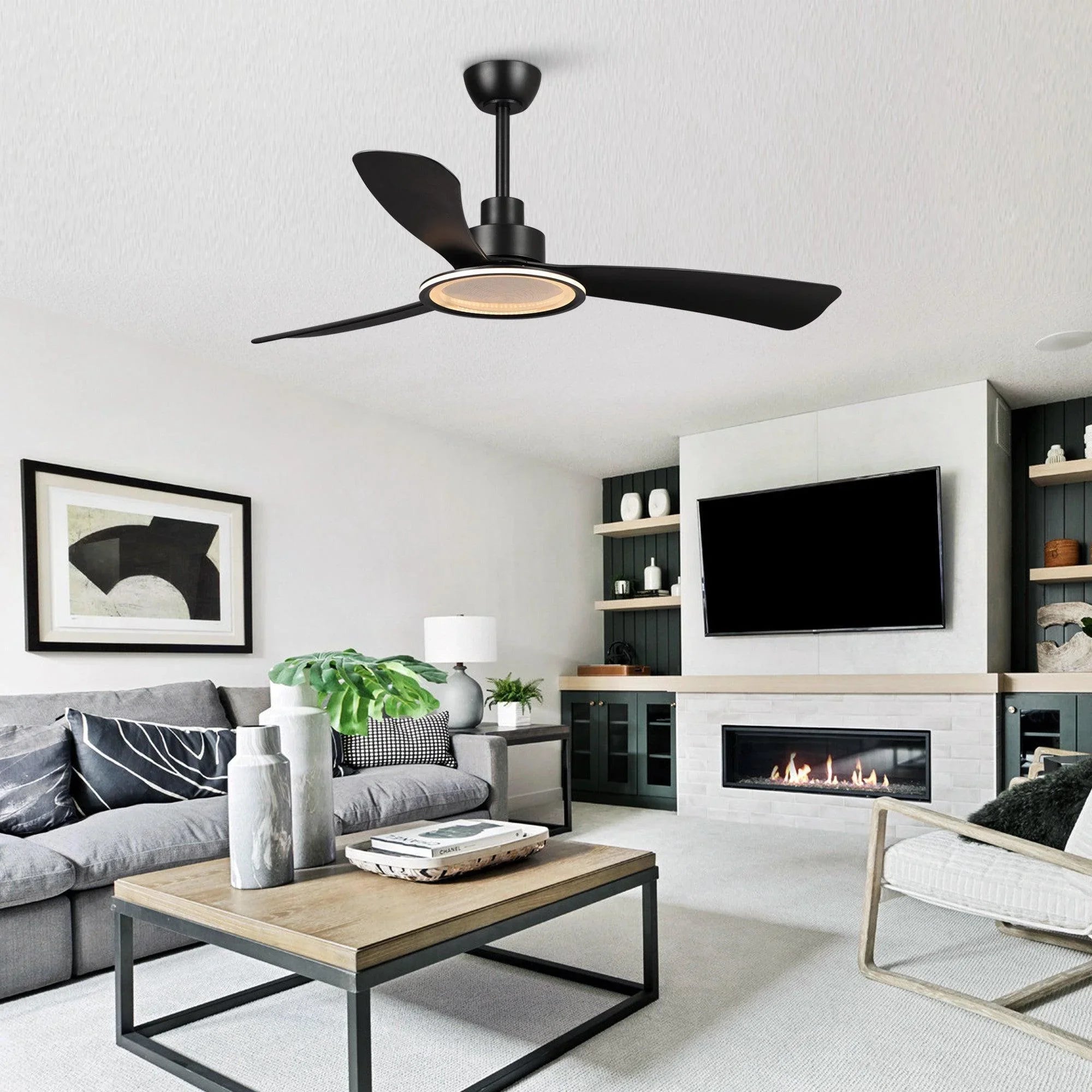 Black ceiling fan with warm-lit light disc and three dark blades