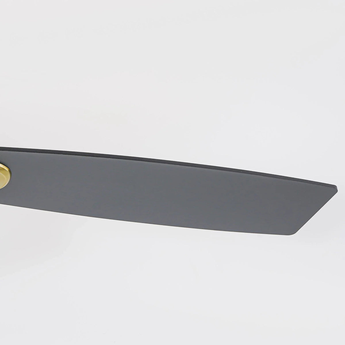 Golden ceiling fan blade with matte dark finish, angled view under ceiling