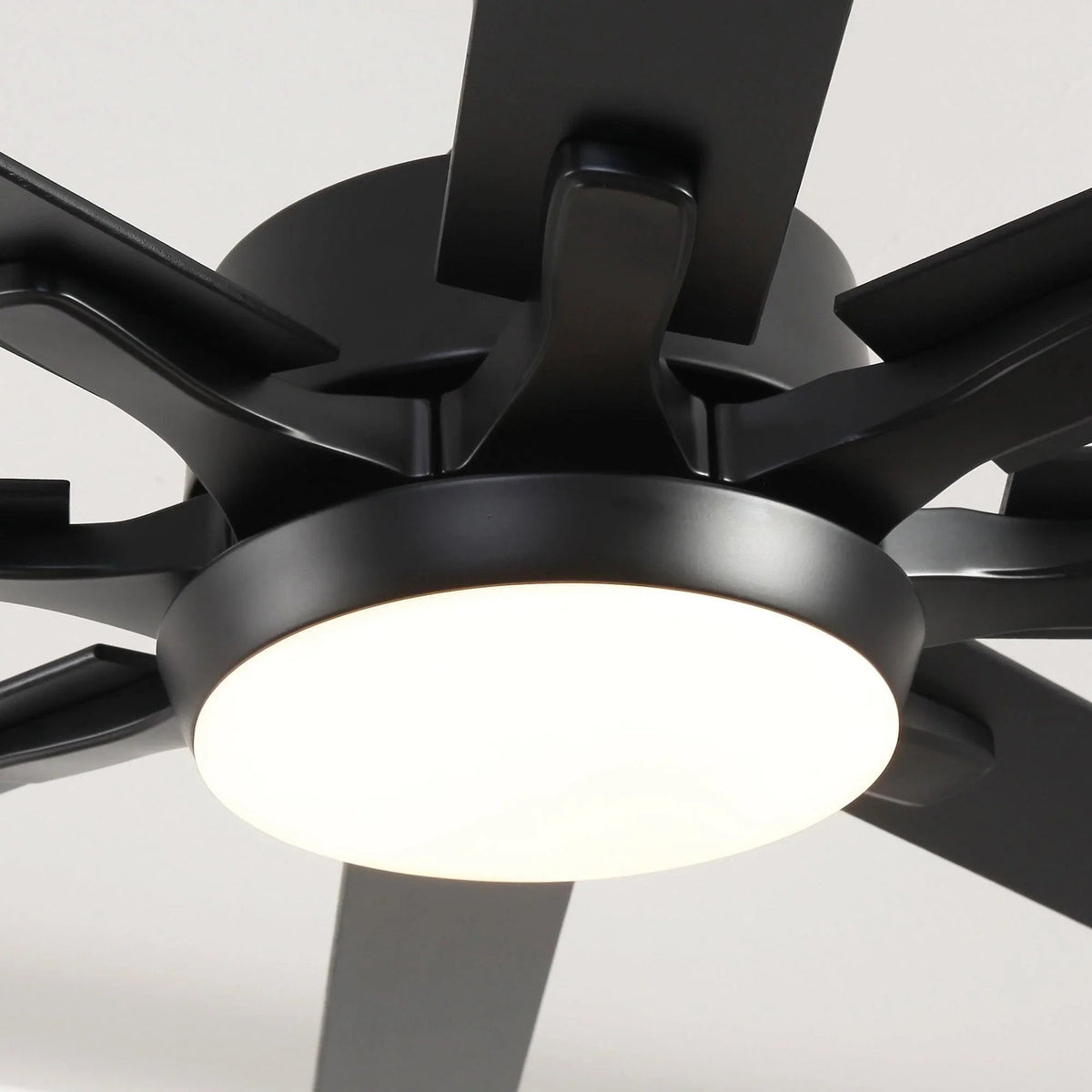 Black five-blade ceiling fan with integrated LED light, close-up