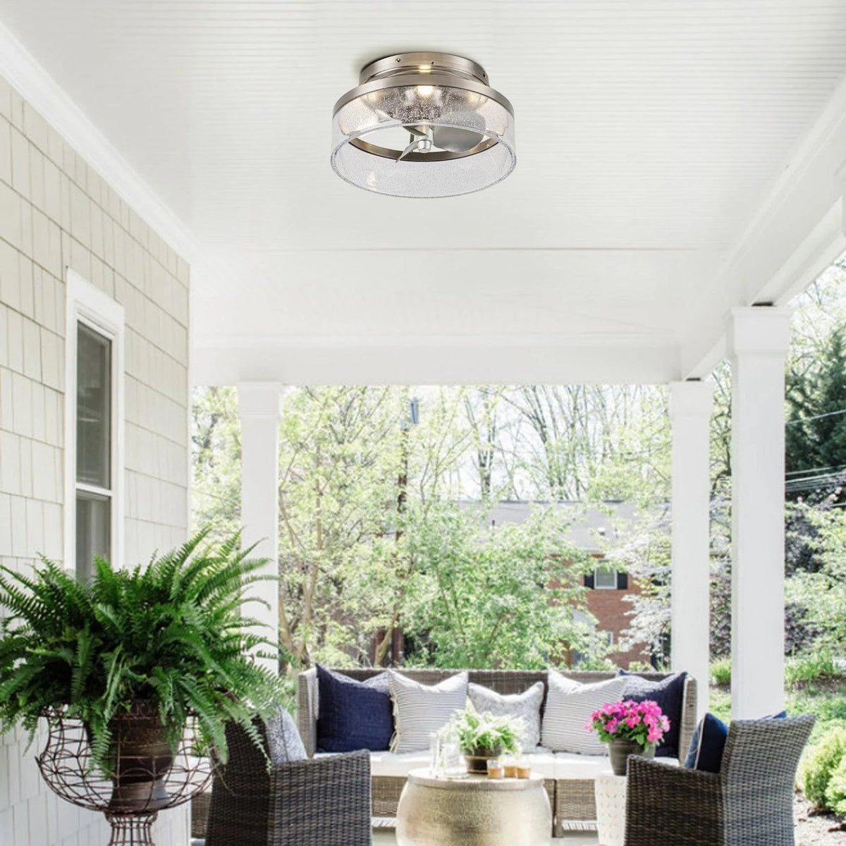 Satin nickel flush mount ceiling fan with frosted glass light cover on ceiling