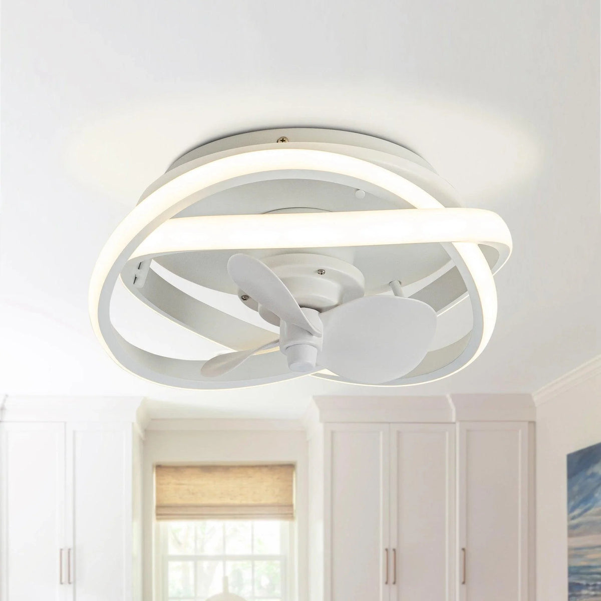 White flush-mount ceiling fan with lit ring light, caged outer frame, and 3 blades