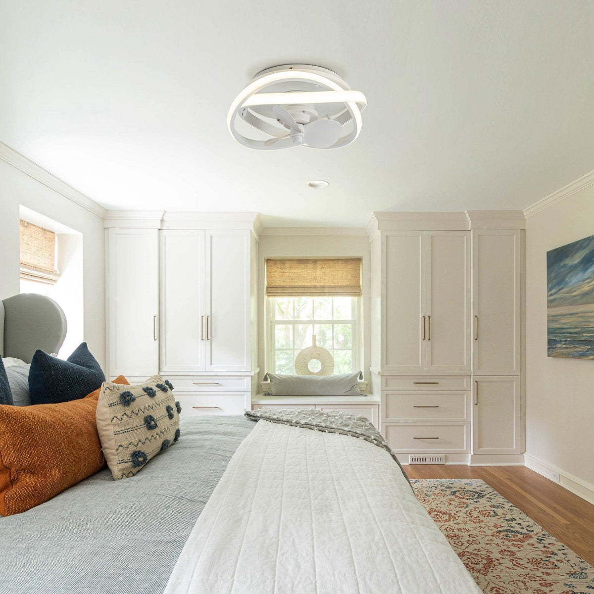 White flush-mount ceiling fan with integrated light and 3 blades, caged design