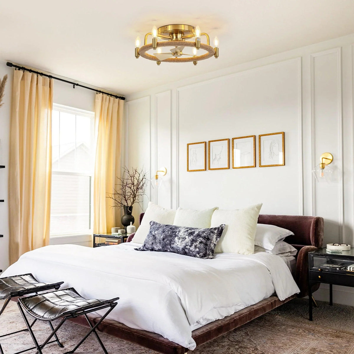 Golden flush mount ceiling fan with light centered over bed, rope-wrapped ring and bulbs