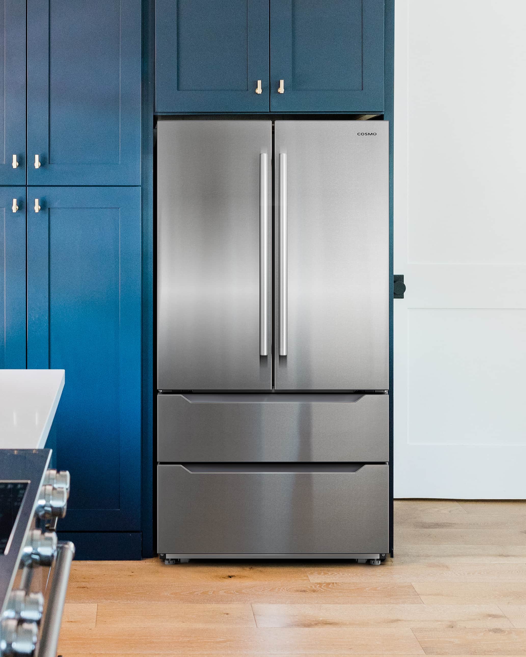 Stainless steel refrigerator with top freezer and two vertical bar handles