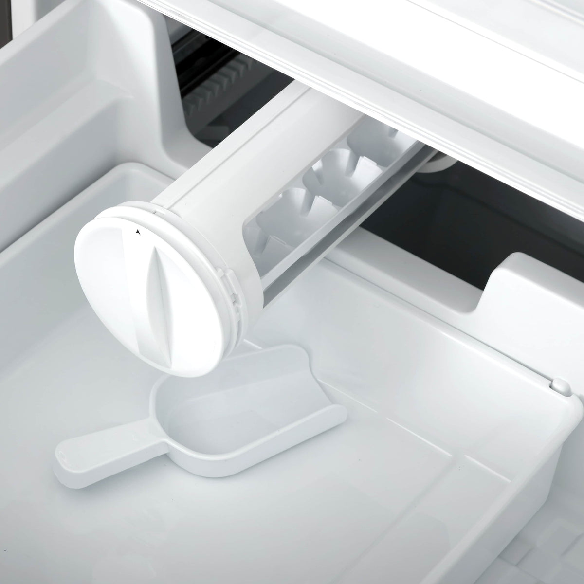 Refrigerator freezer compartment with pull-out bin and round ice tray holder