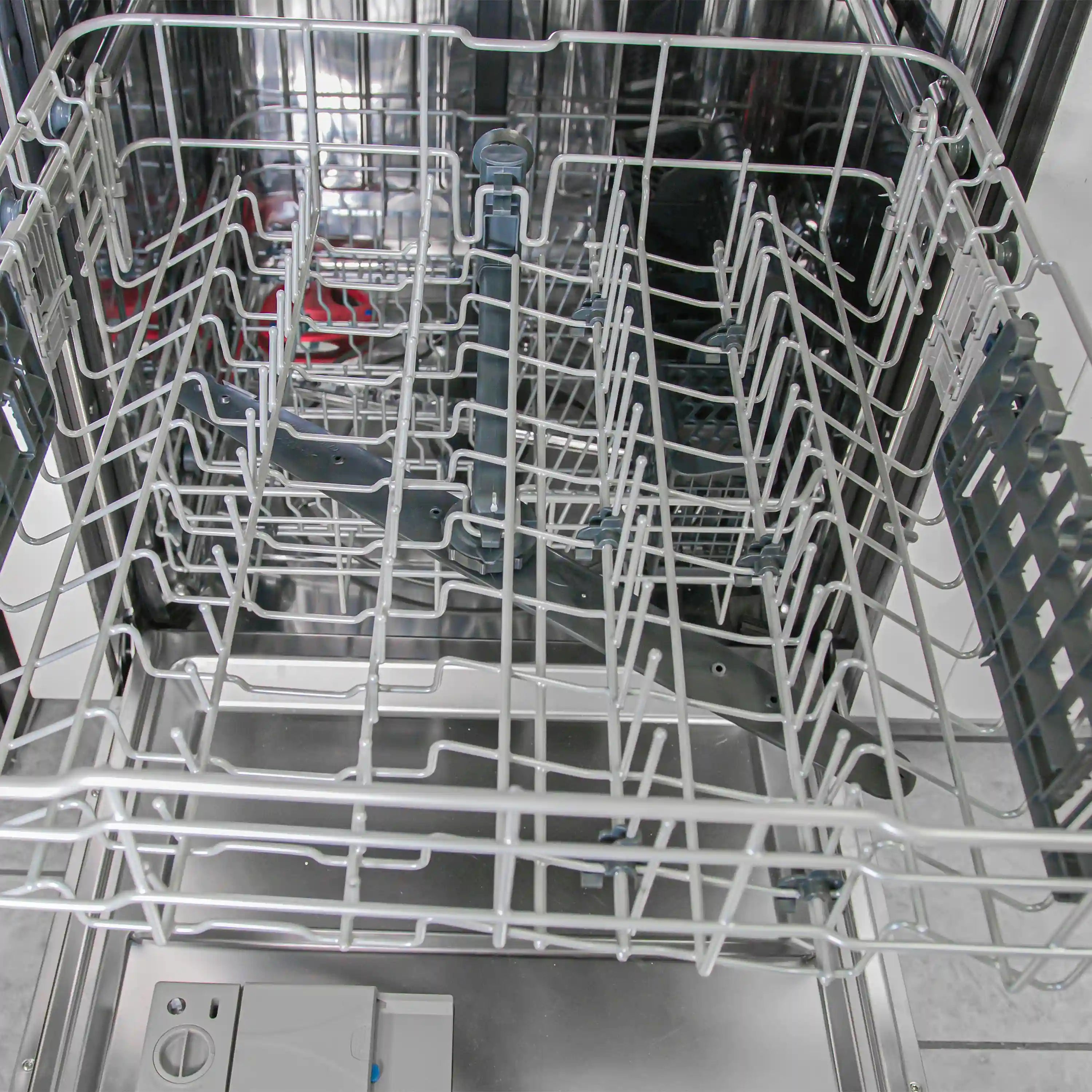 Stainless steel dishwasher with bottom rack and silverware rack inside open door