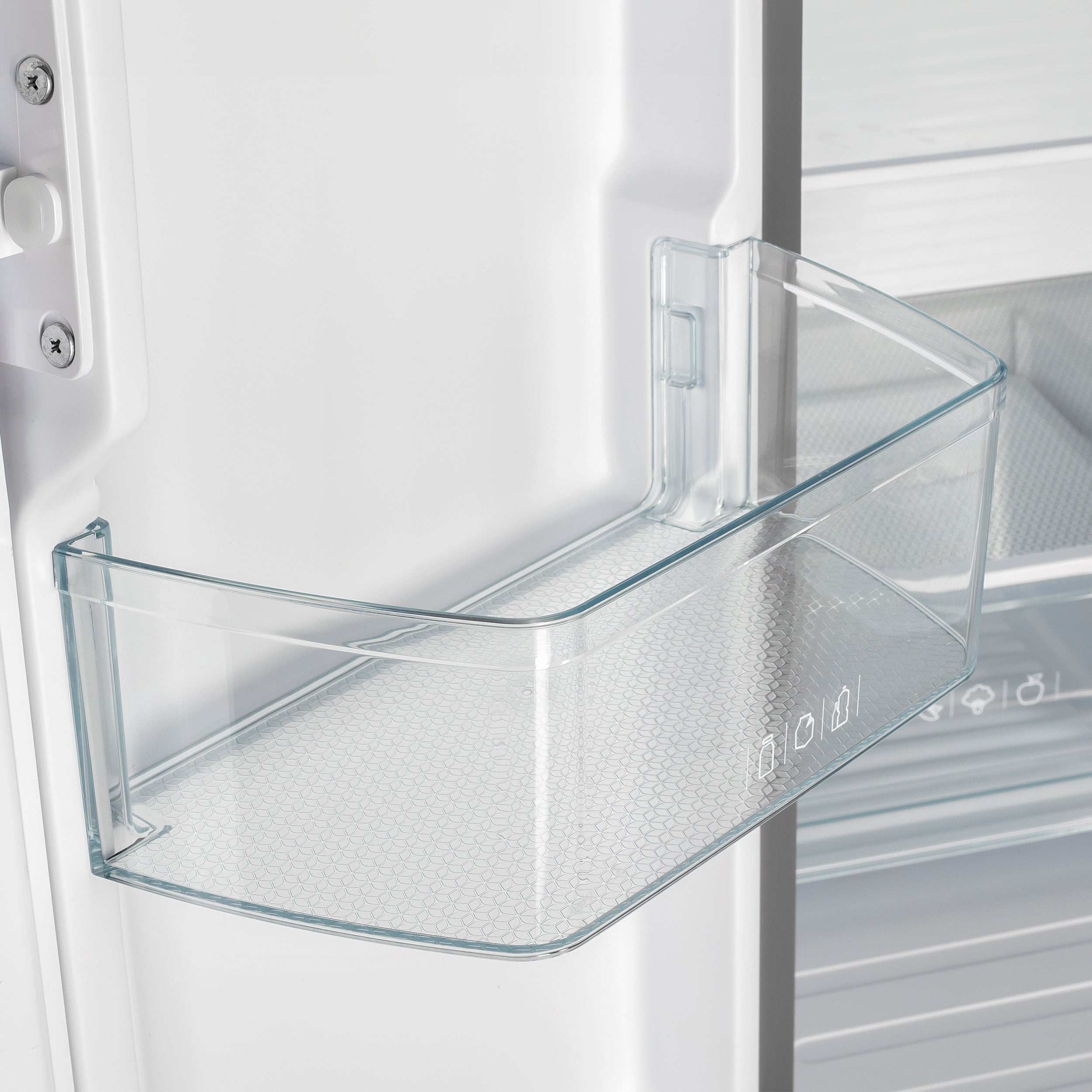 White refrigerator with clear glass shelf in the door bin area