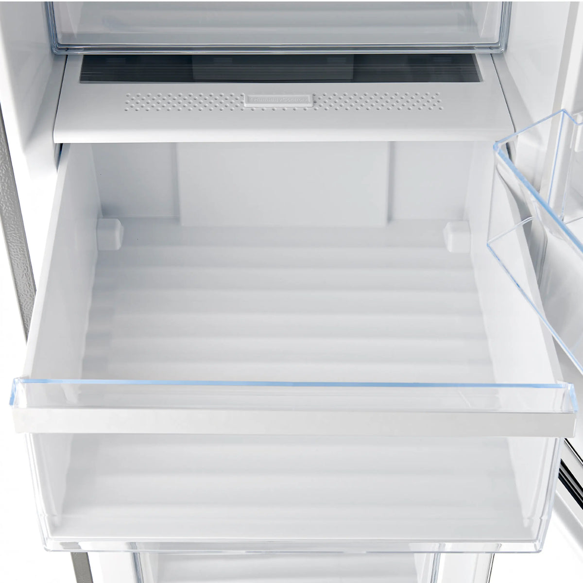 Stainless steel refrigerator lower drawer space with vented panel and clear bin