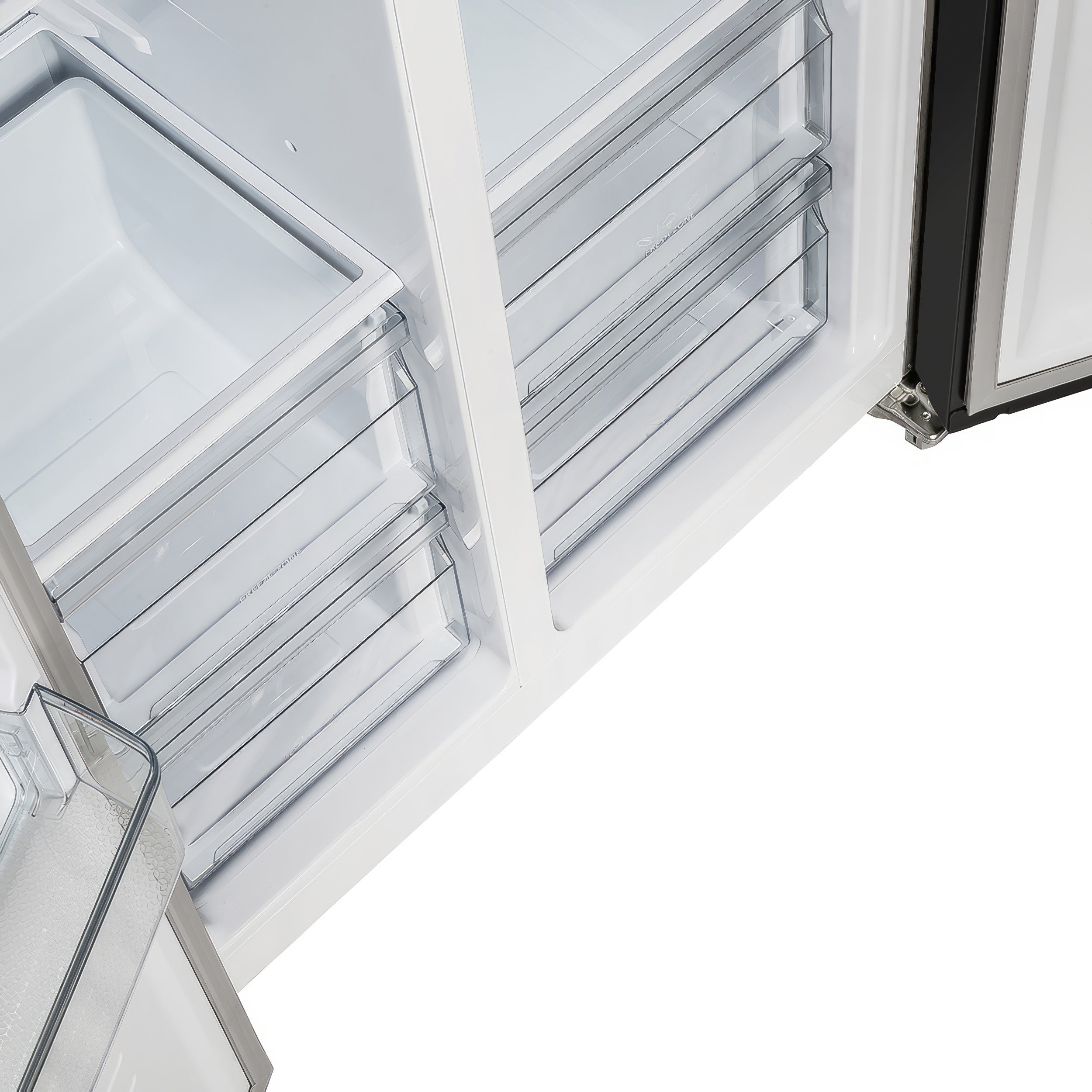 Refrigerator freezer drawer area with clear slide-out bins and white interior
