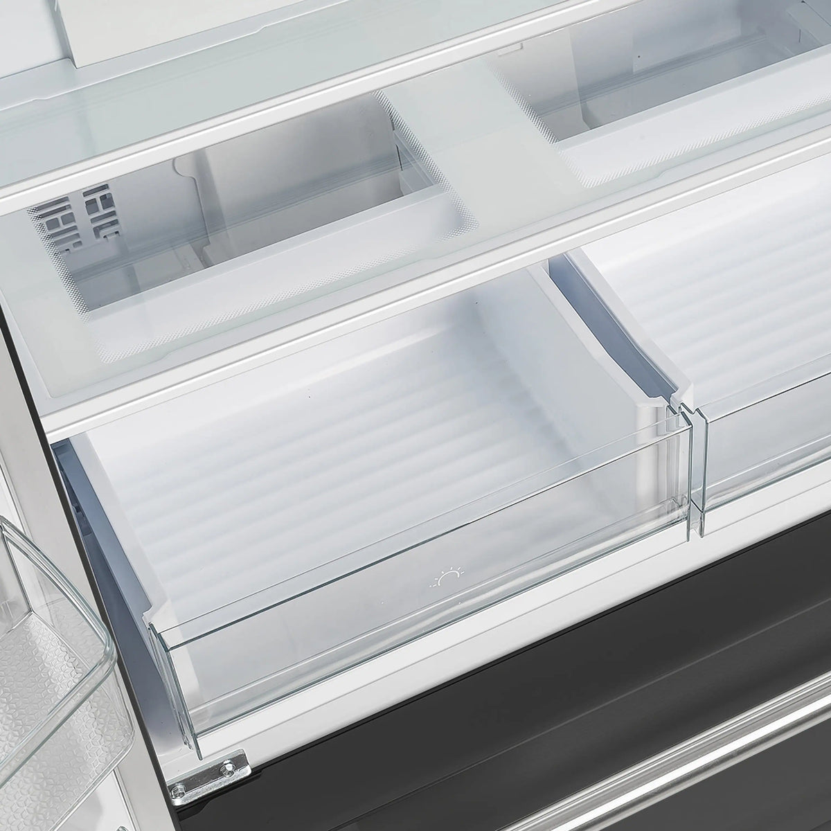 Black refrigerator freezer drawer with clear glass shelf and metal rails