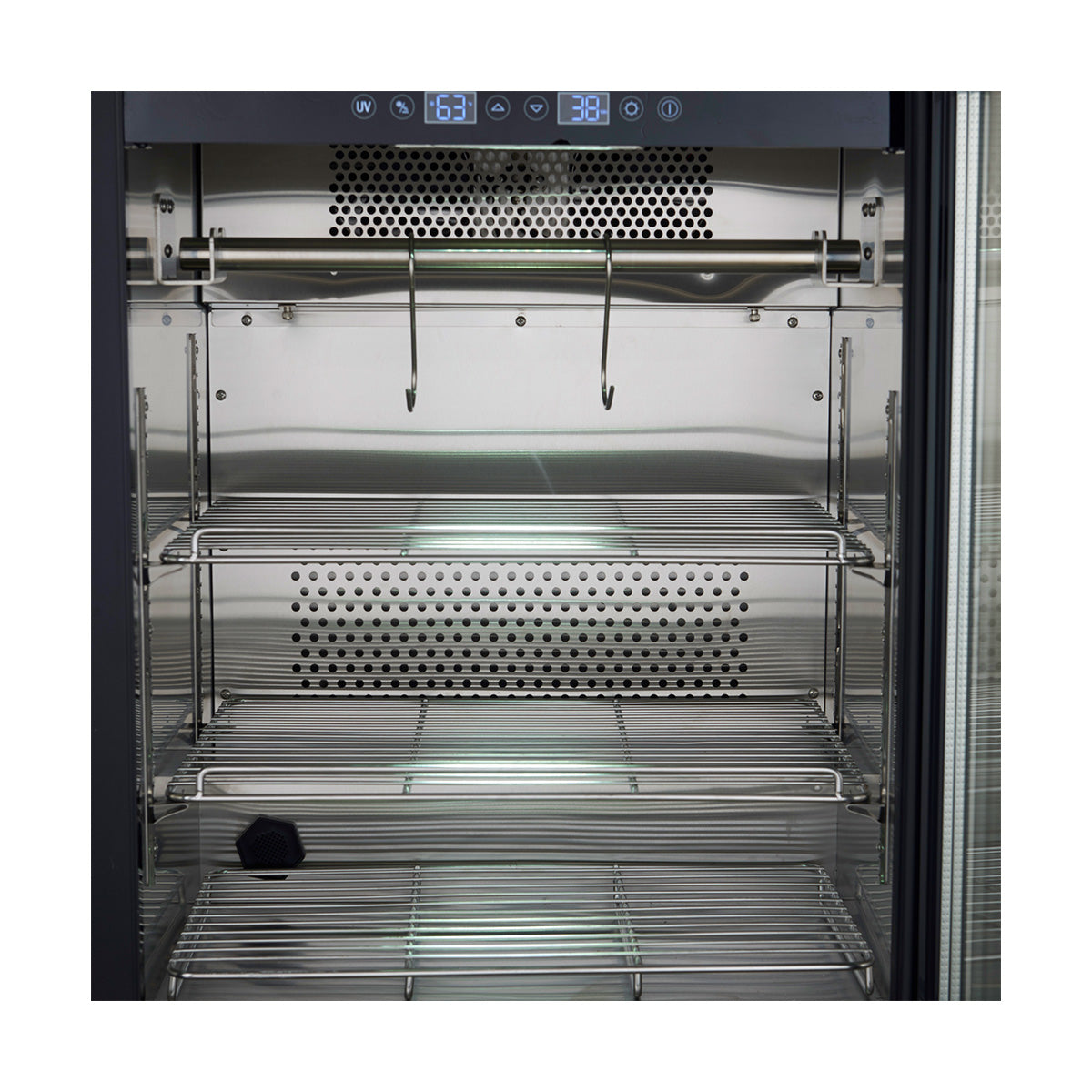 Inside dry aging cabinet with stainless wire shelves and perforated rear air panel