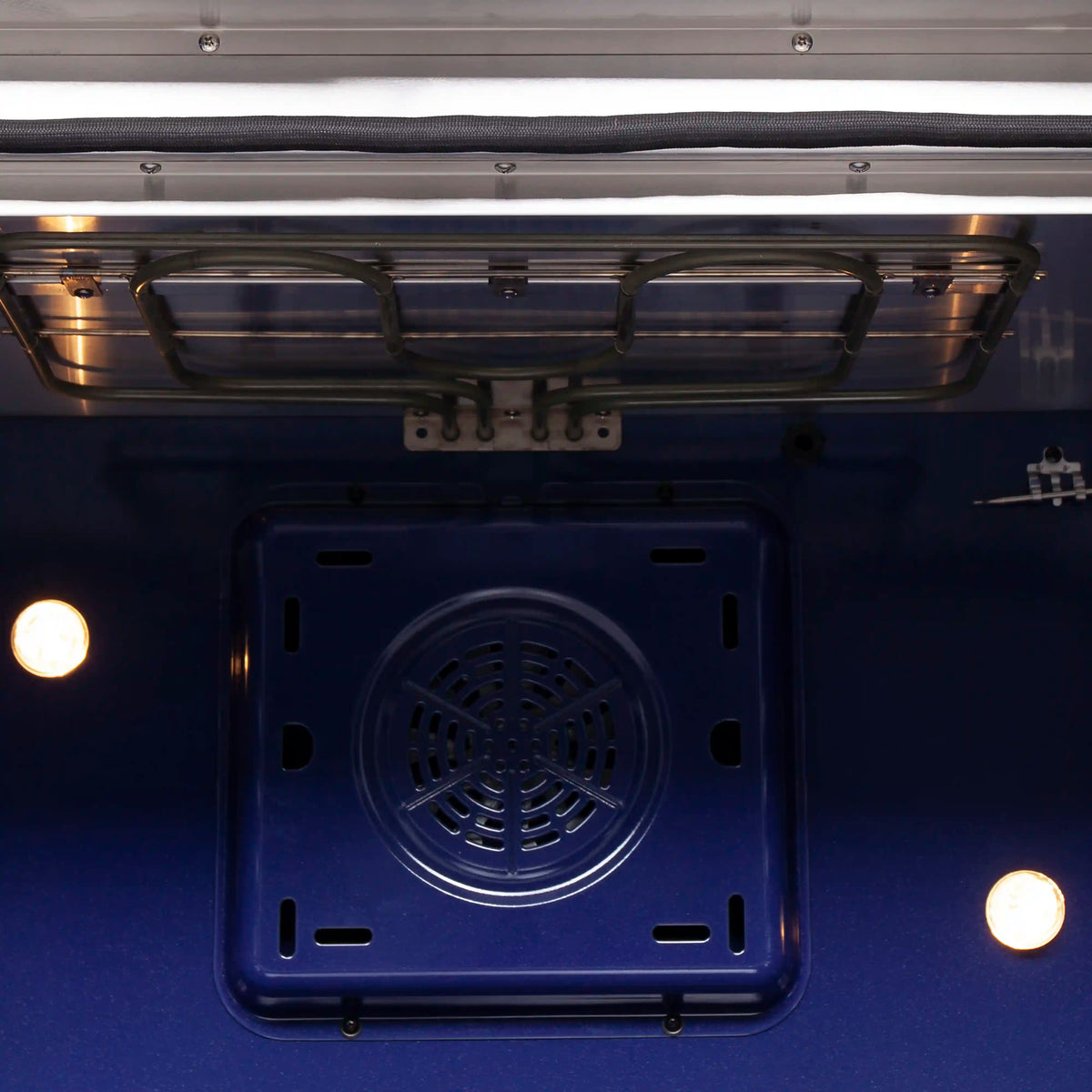 Electric oven range with blue interior and circular fan vent in oven floor