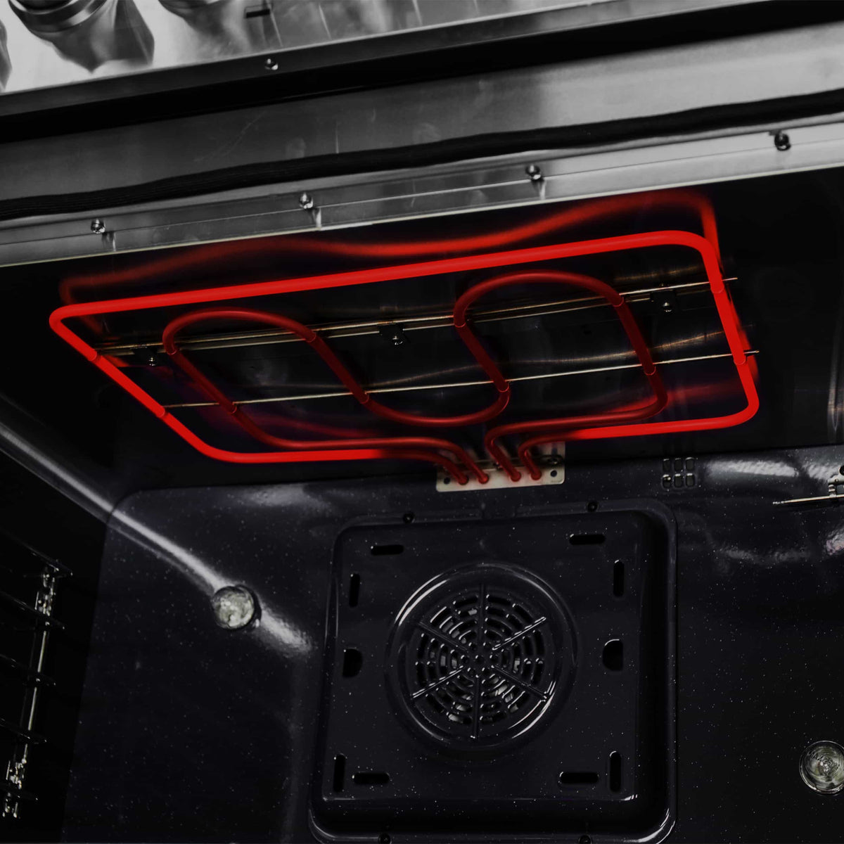 Dual fuel range oven floor with red heating element and cooling fan vent