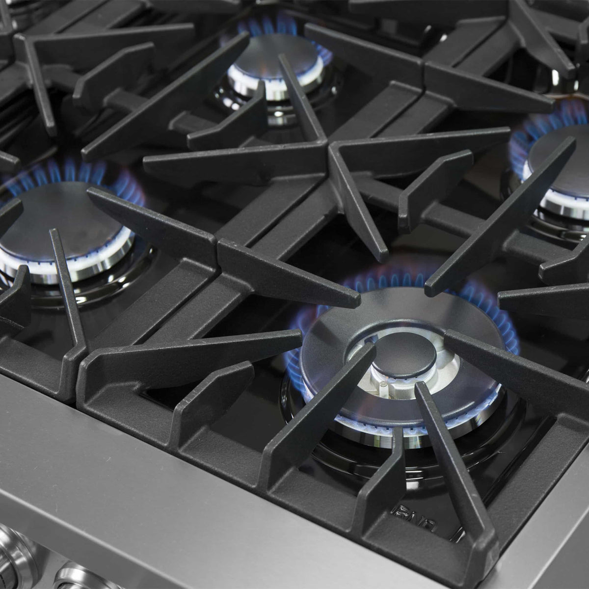 Dual fuel range cooktop with grates and multiple cast-iron gas burners