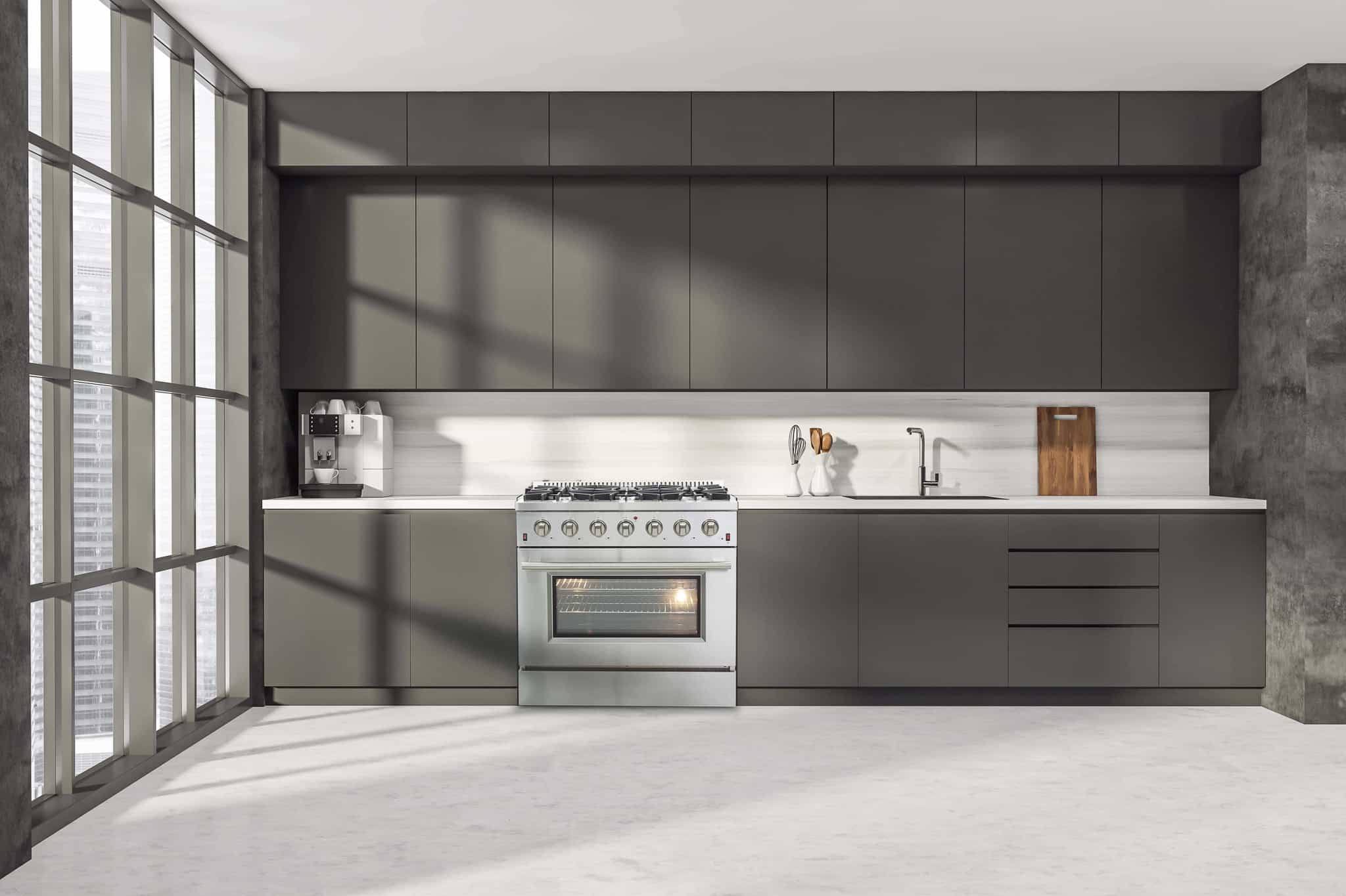 Stainless steel gas range with oven door and smooth control panel in an open kitchen