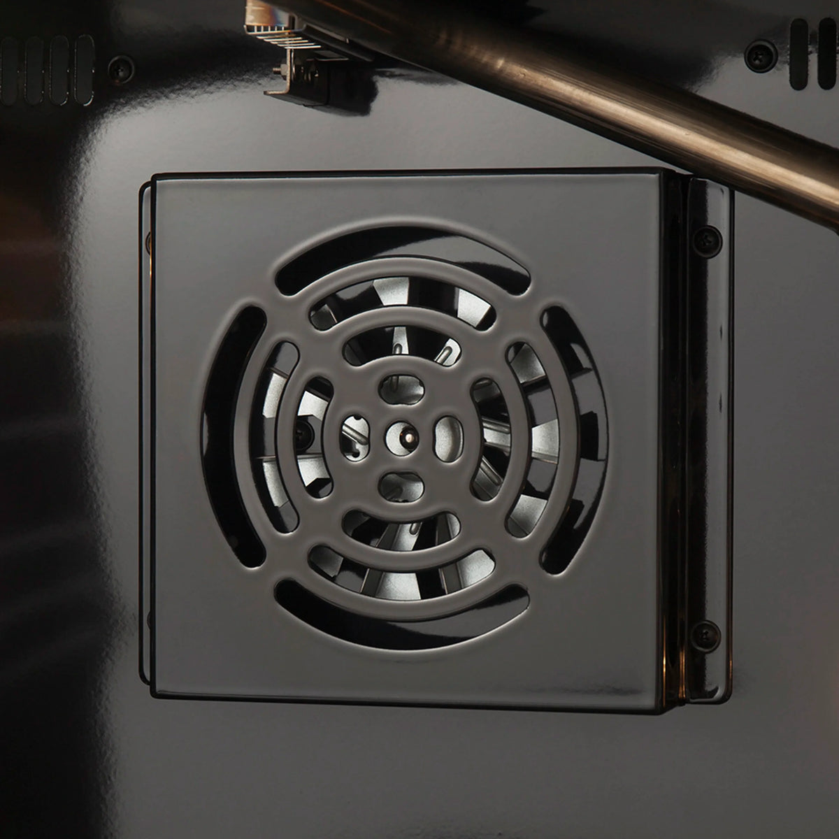 Stainless steel oven door vent panel with circular fan-style grill