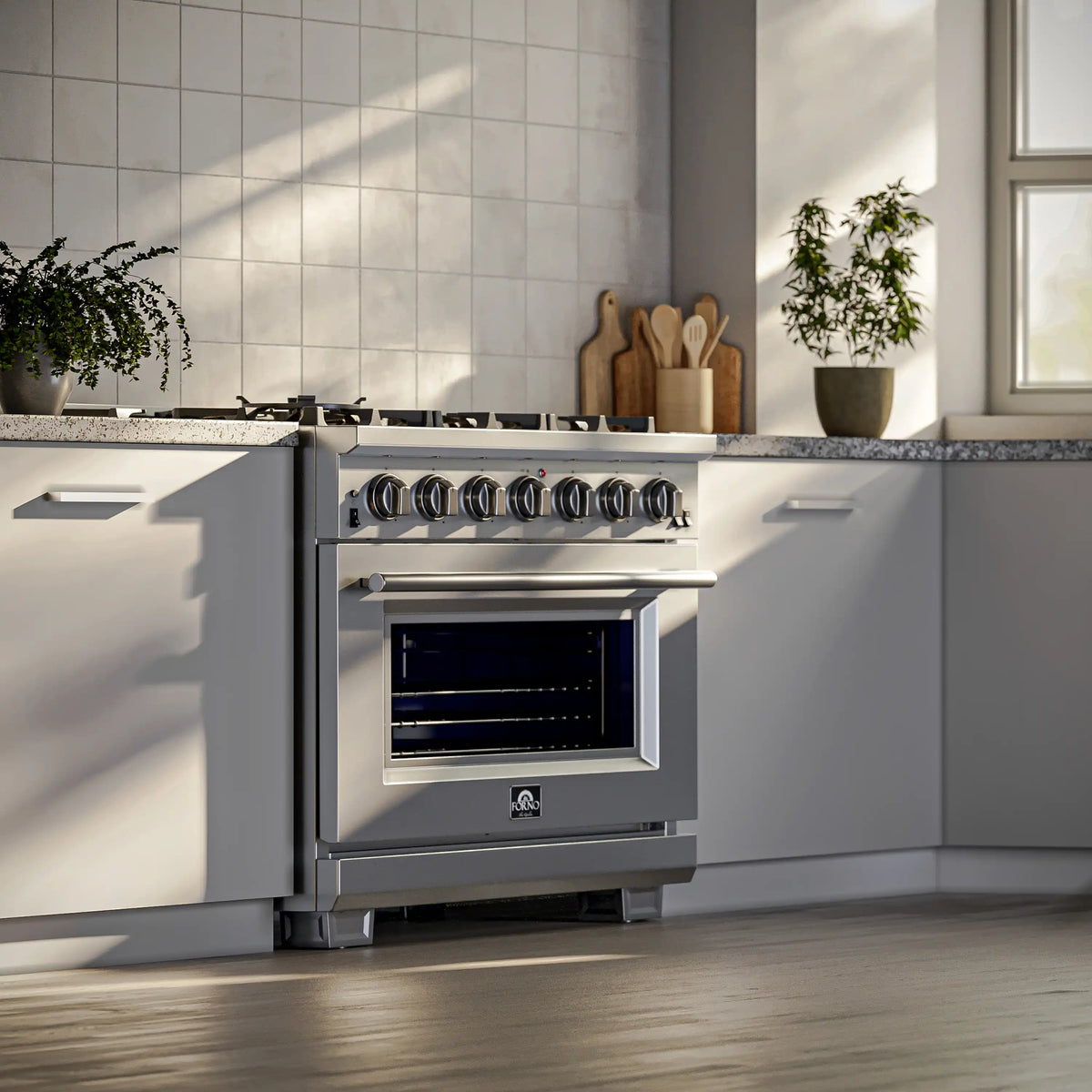 Stainless steel gas range with oven door window and control knobs in kitchen