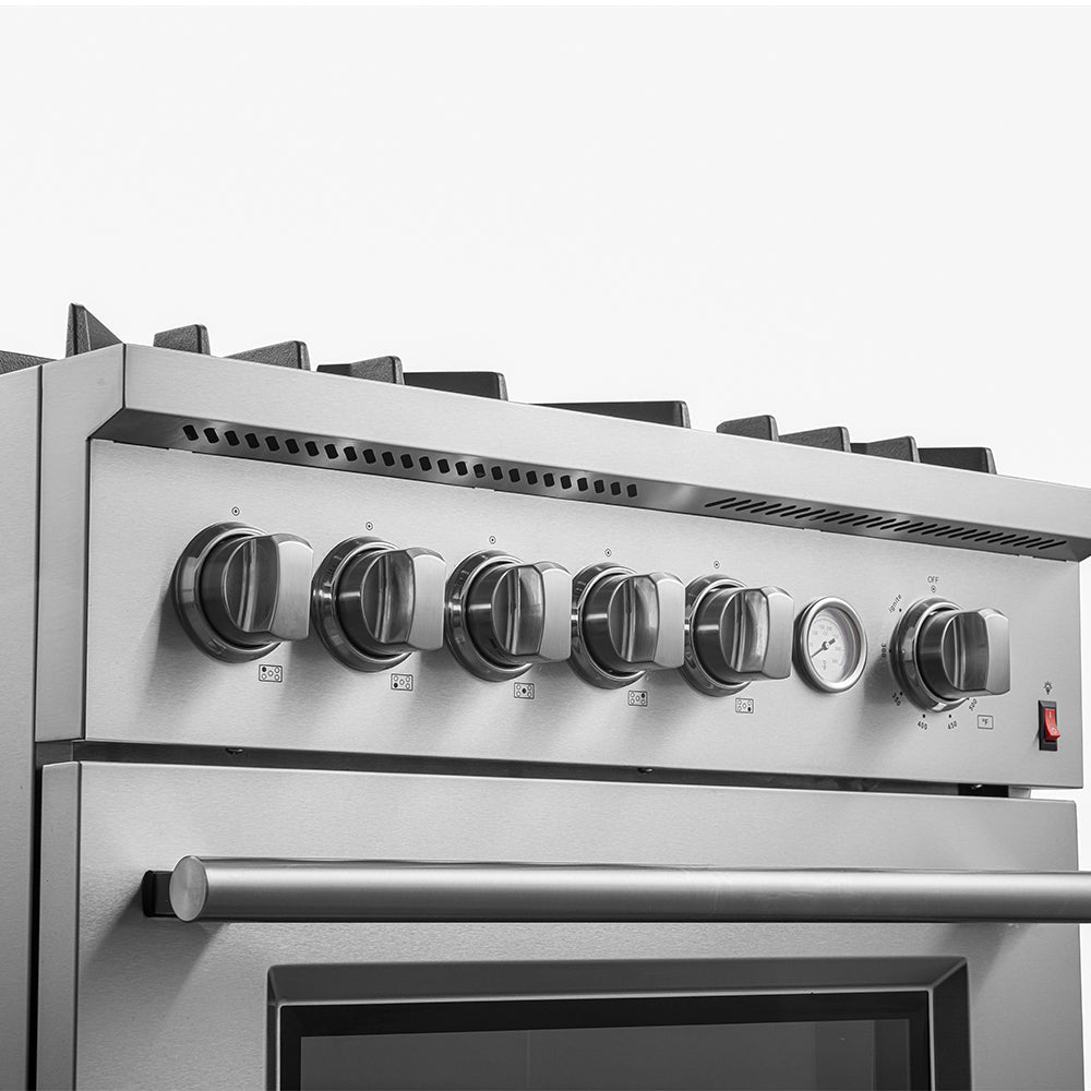 Stainless steel gas range control panel with six knobs and vent hood