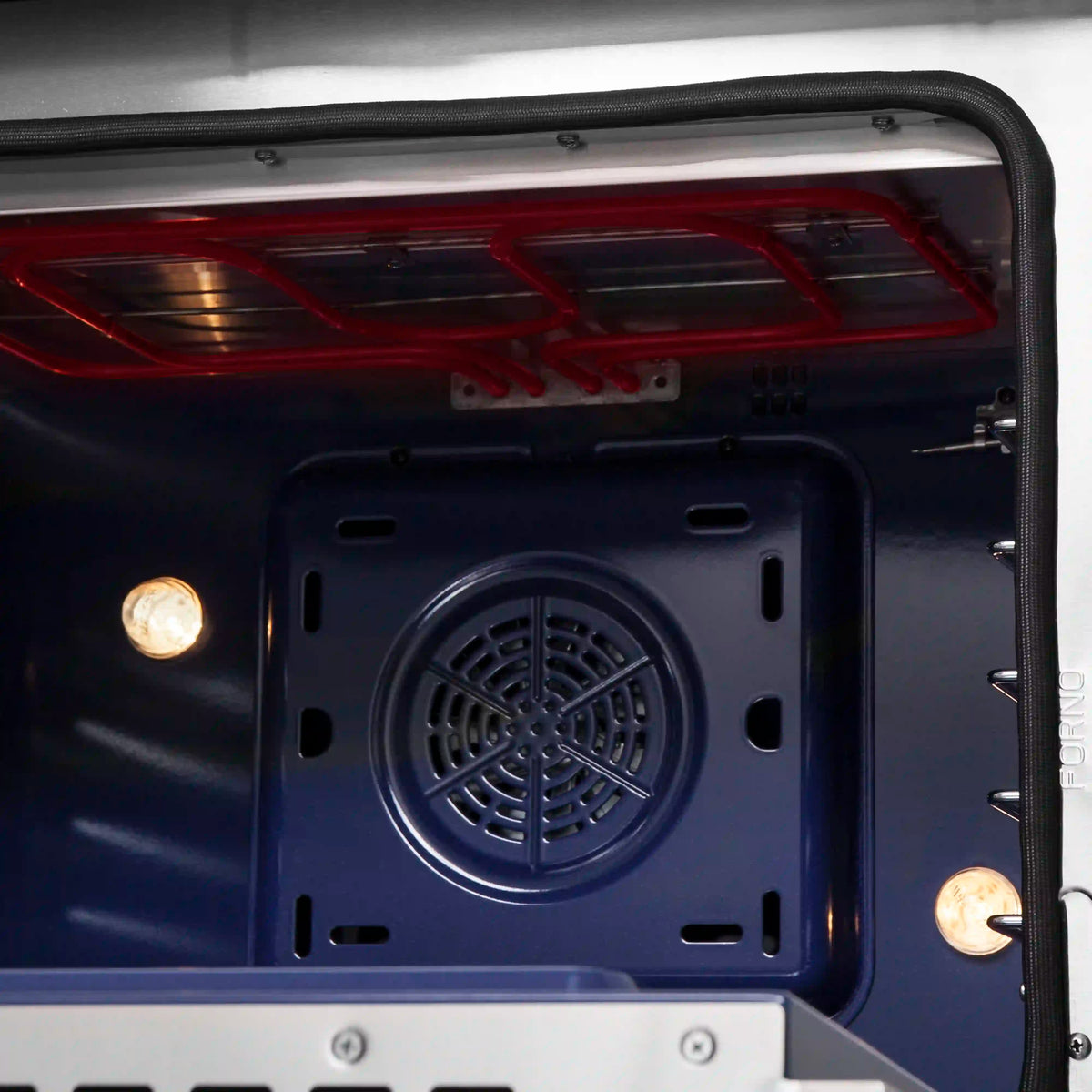 Dual fuel oven door window with round convection fan and interior light, blue finish.