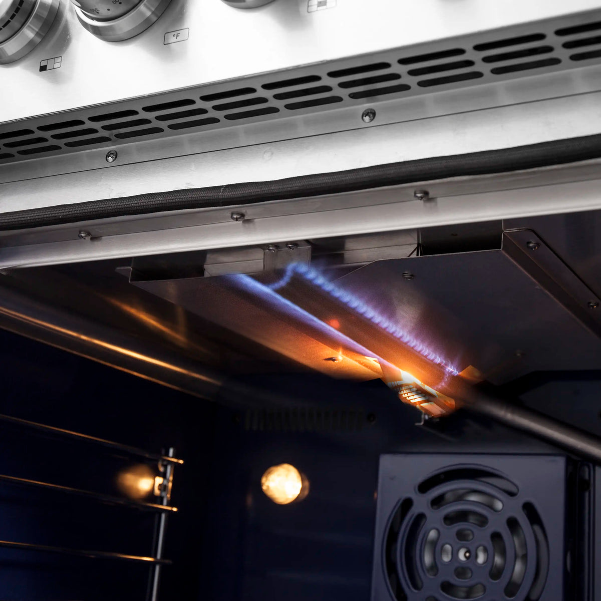 Stainless steel gas range oven burner flame under the oven cavity with vented panel