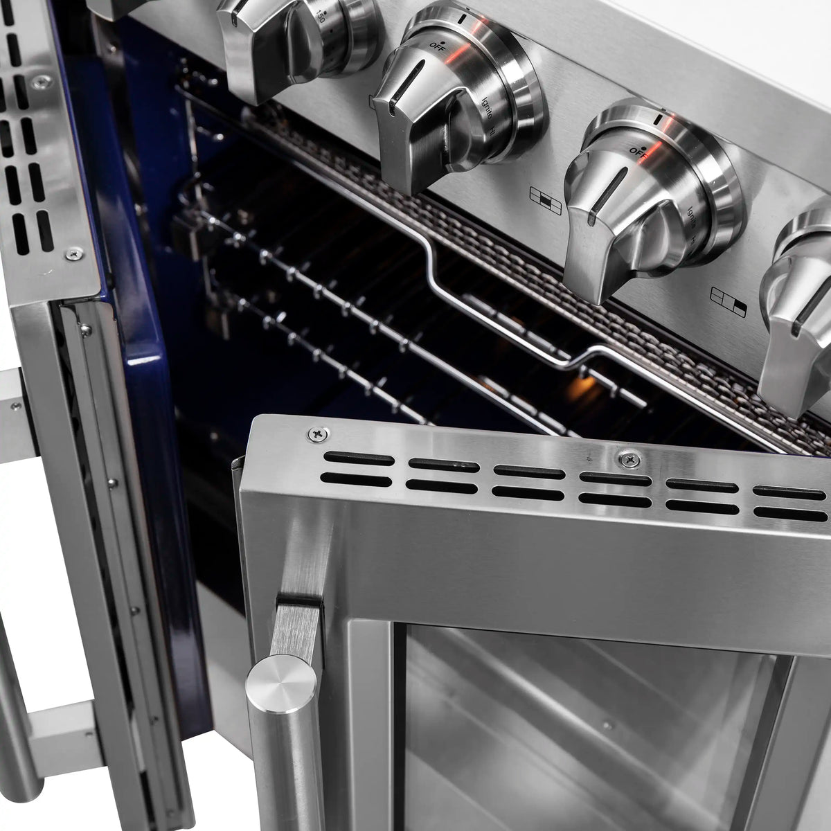Stainless steel gas range oven with side controls and burner grates along the back wall