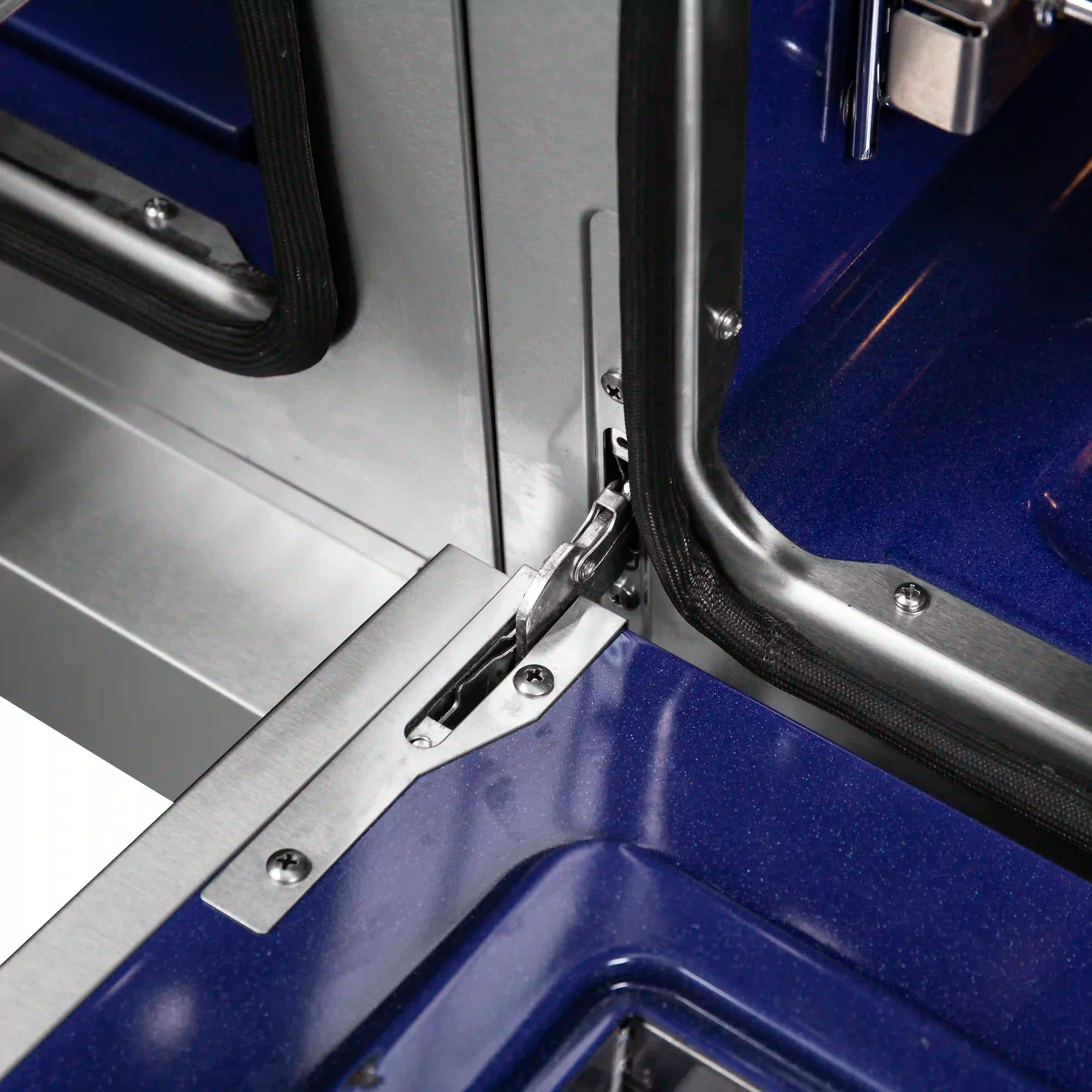 Stainless steel French door range hinge and handle area
