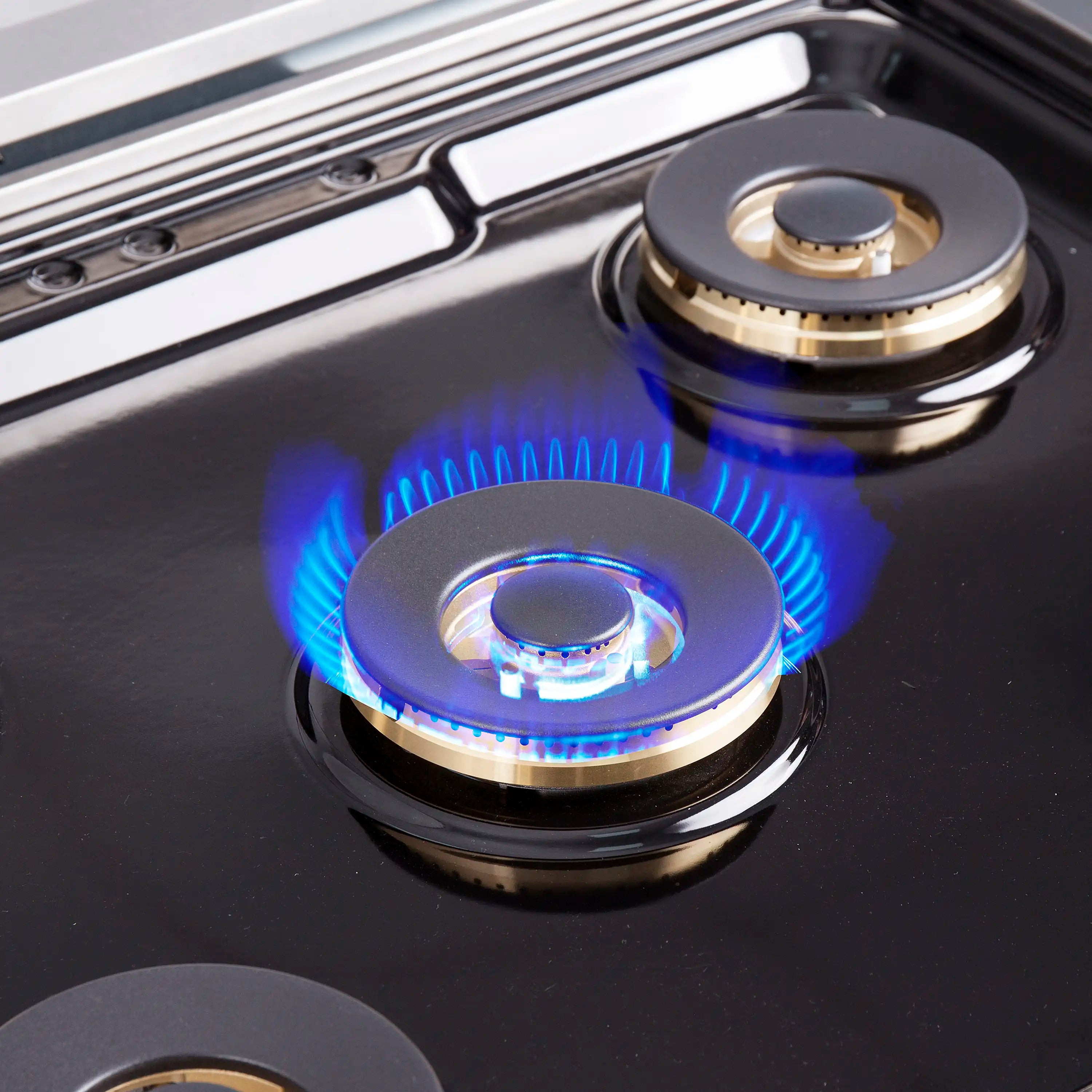 Black gas cooktop with two blue flame burners and circular stainless knobs