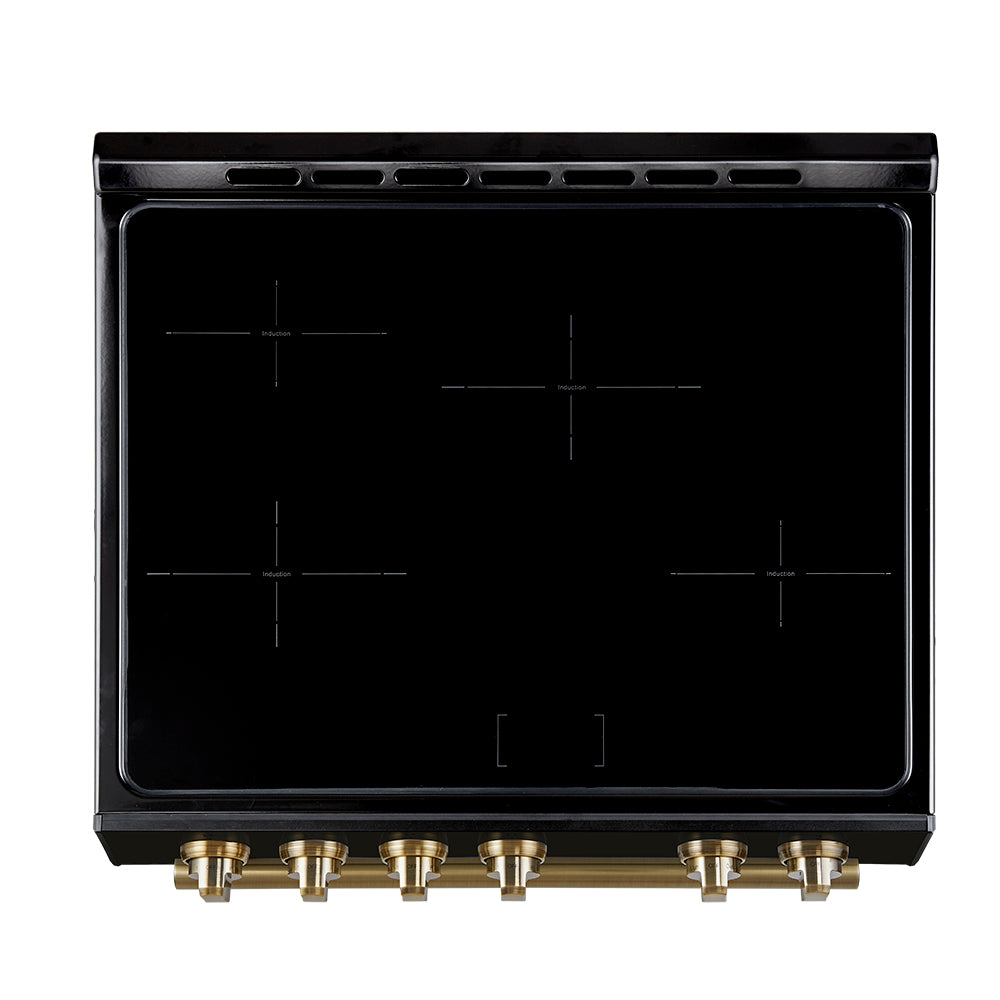 Black cooktop glass with gold-toned control knobs along the front edge