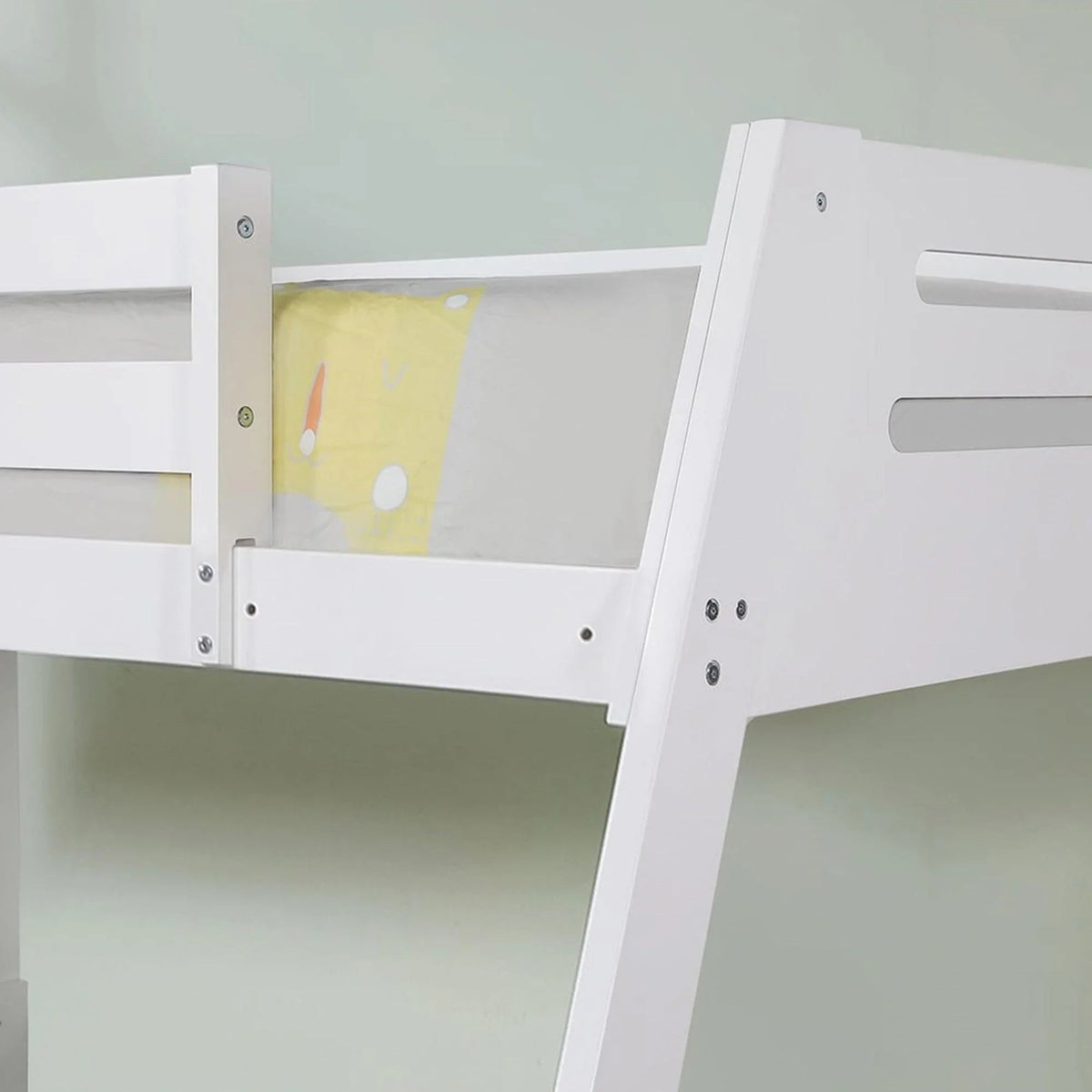 White twin-over-twin bunk bed with side guard panel and ladder section