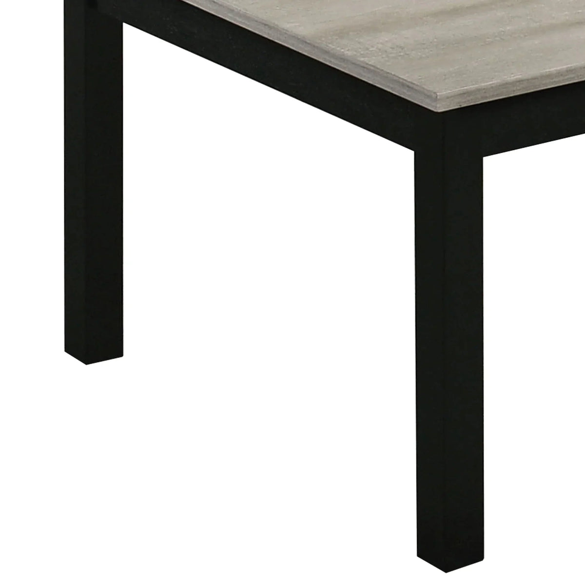 Close-up corner of gray tabletop with dark legs on a rectangular coffee table.