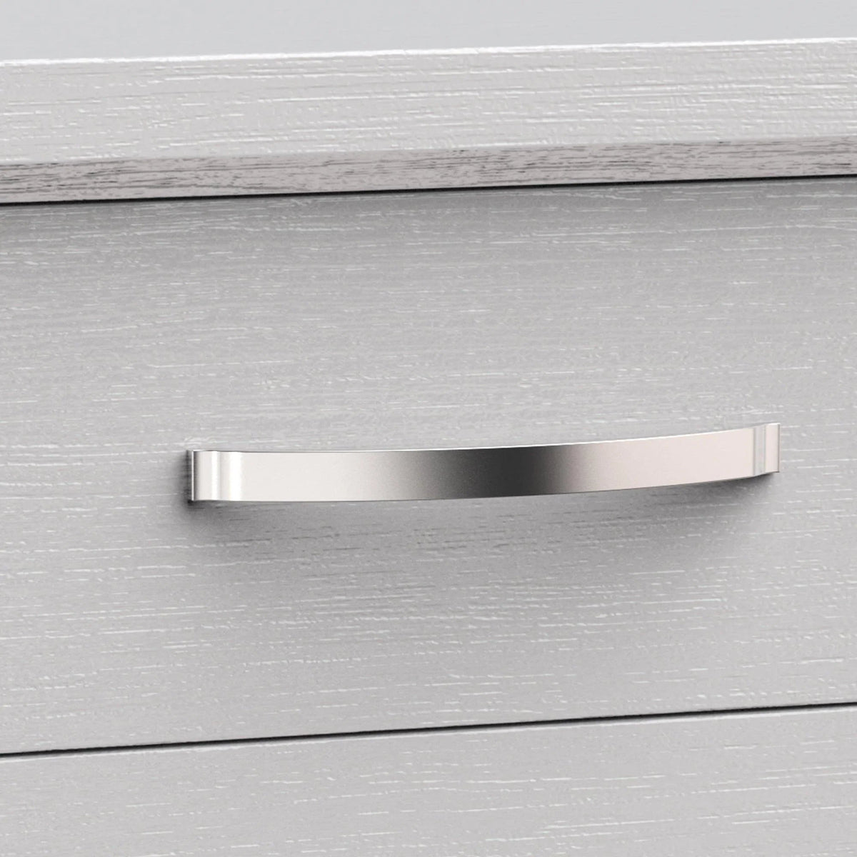 Close-up of brushed metal bar handle on light gray two-drawer nightstand
