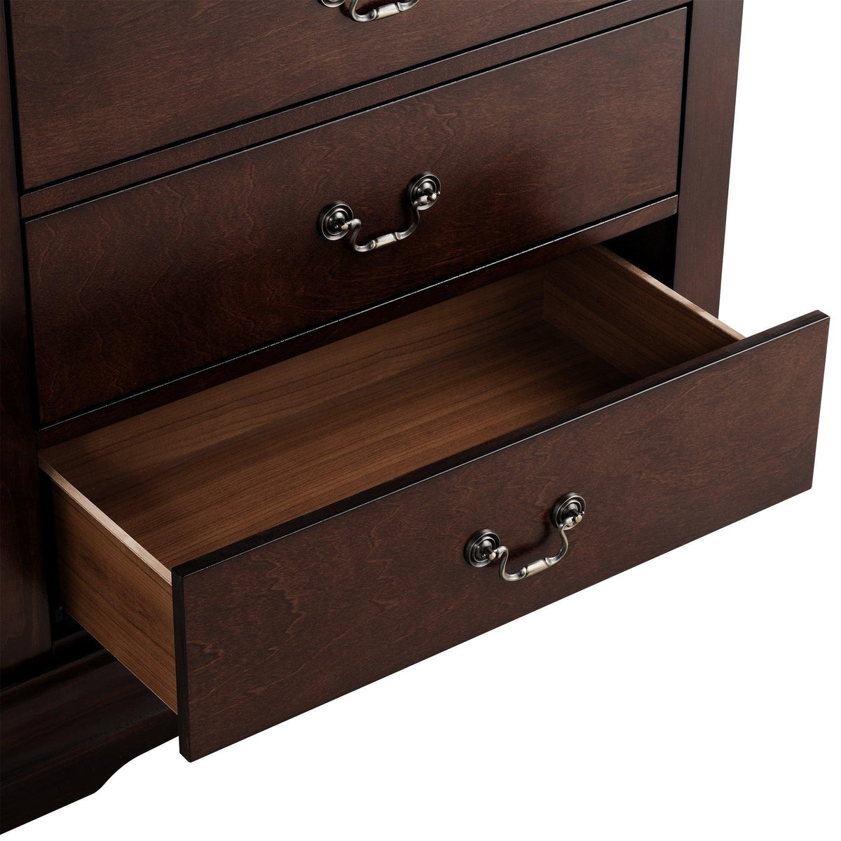 Brown chest drawer detail with open drawer box and curved metal pull handle.