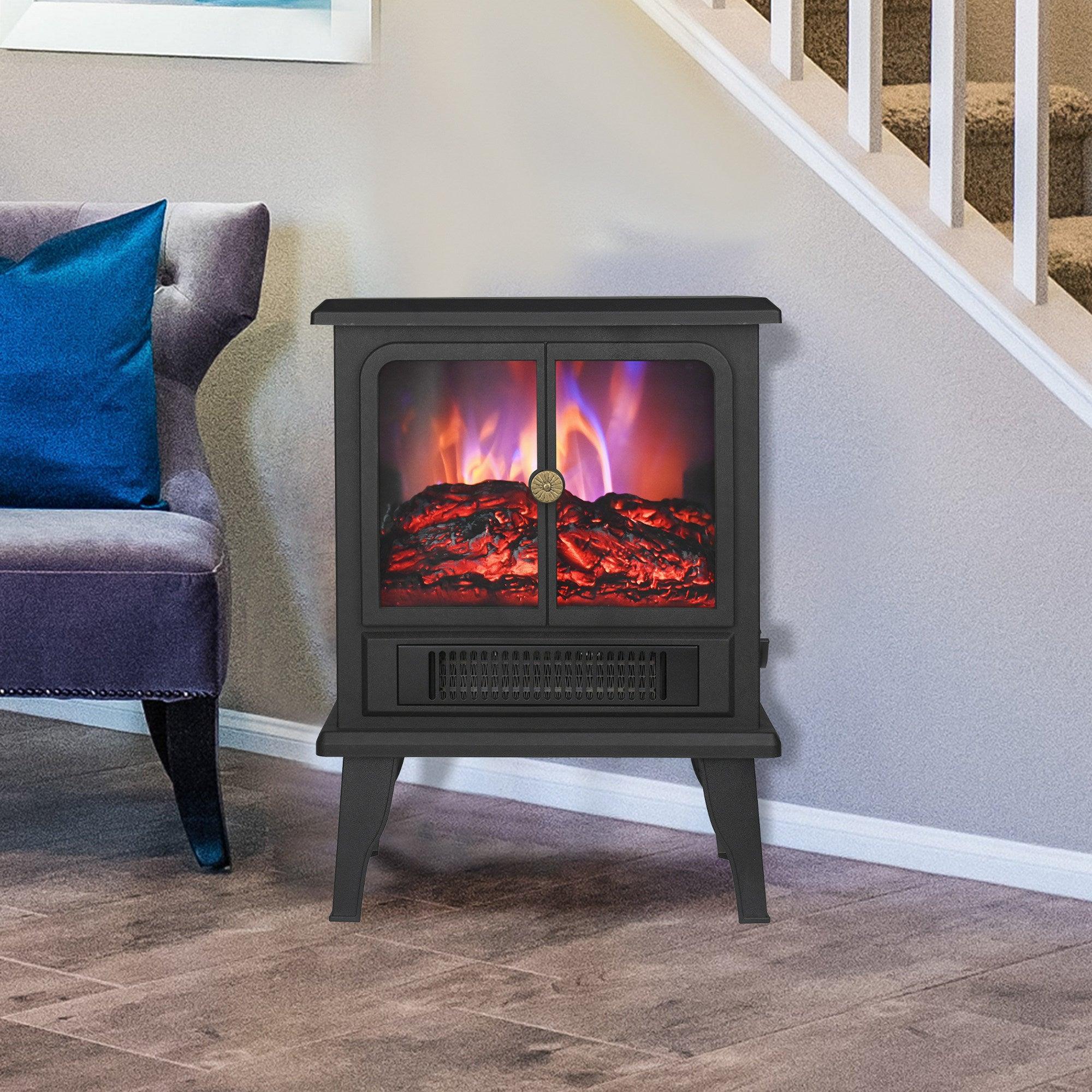 Black electric fireplace heater placed on the floor near a staircase and living room seating