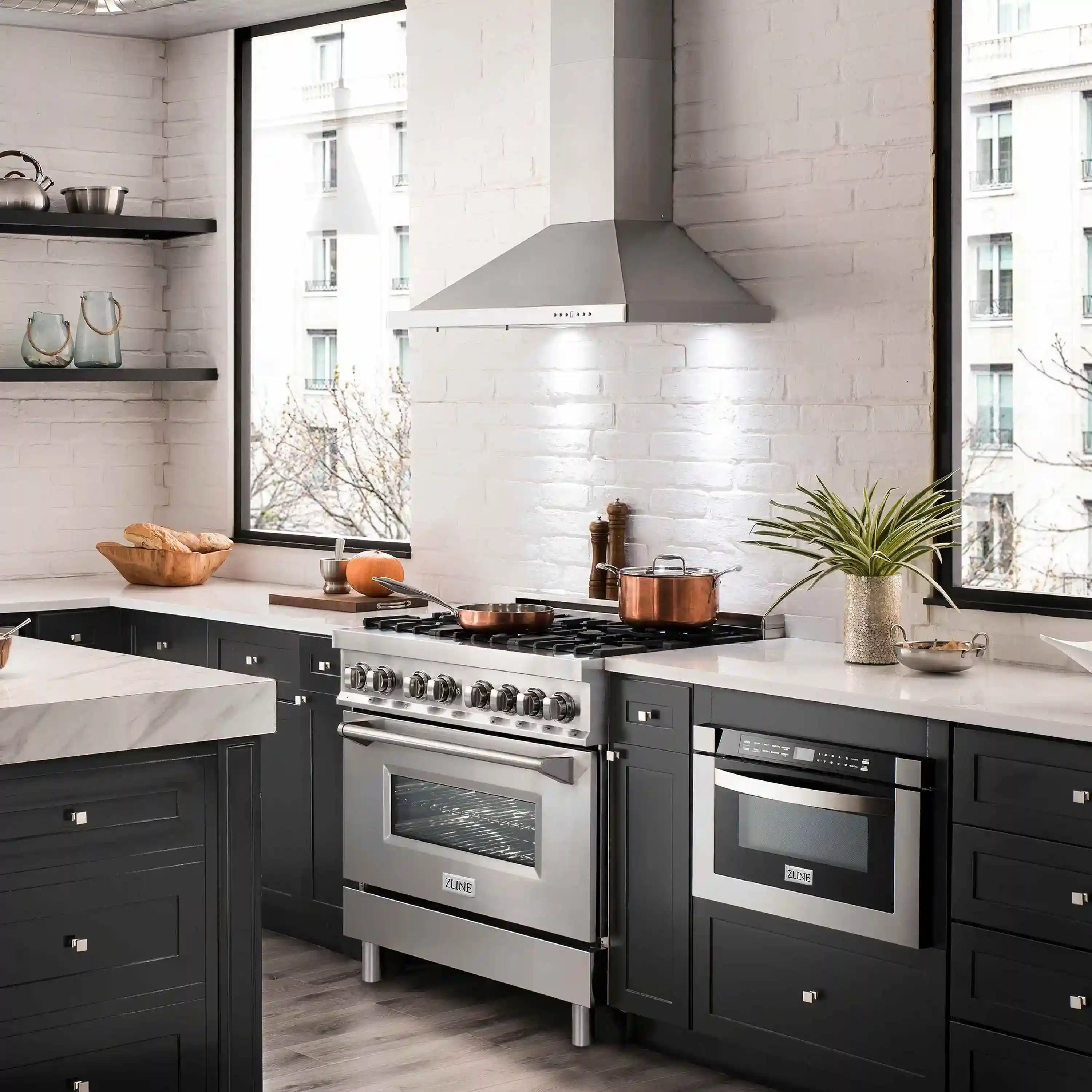 Stainless steel range with gas burners and matching over-the-range hood