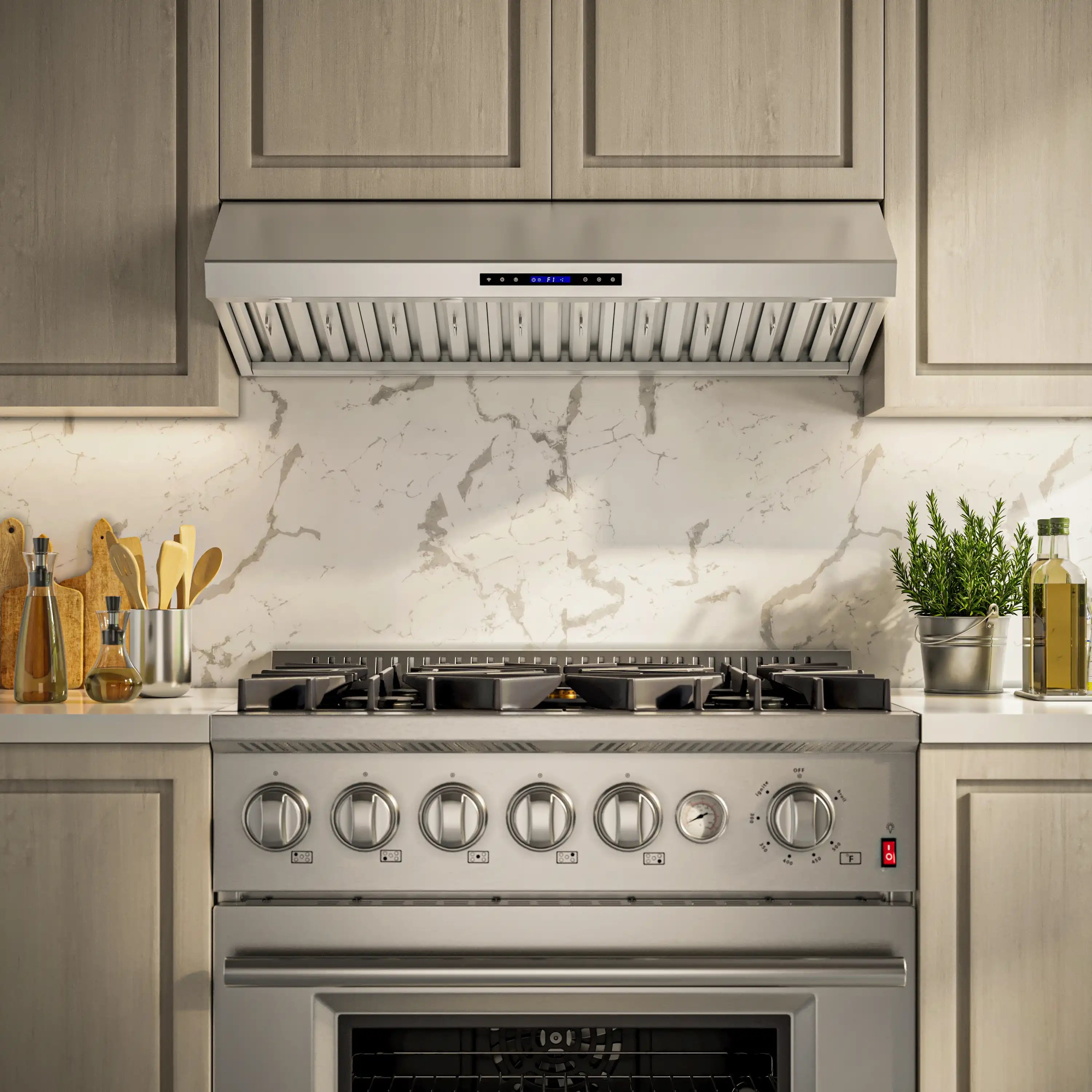 Under-cabinet stainless steel range hood installed above a gas cooktop