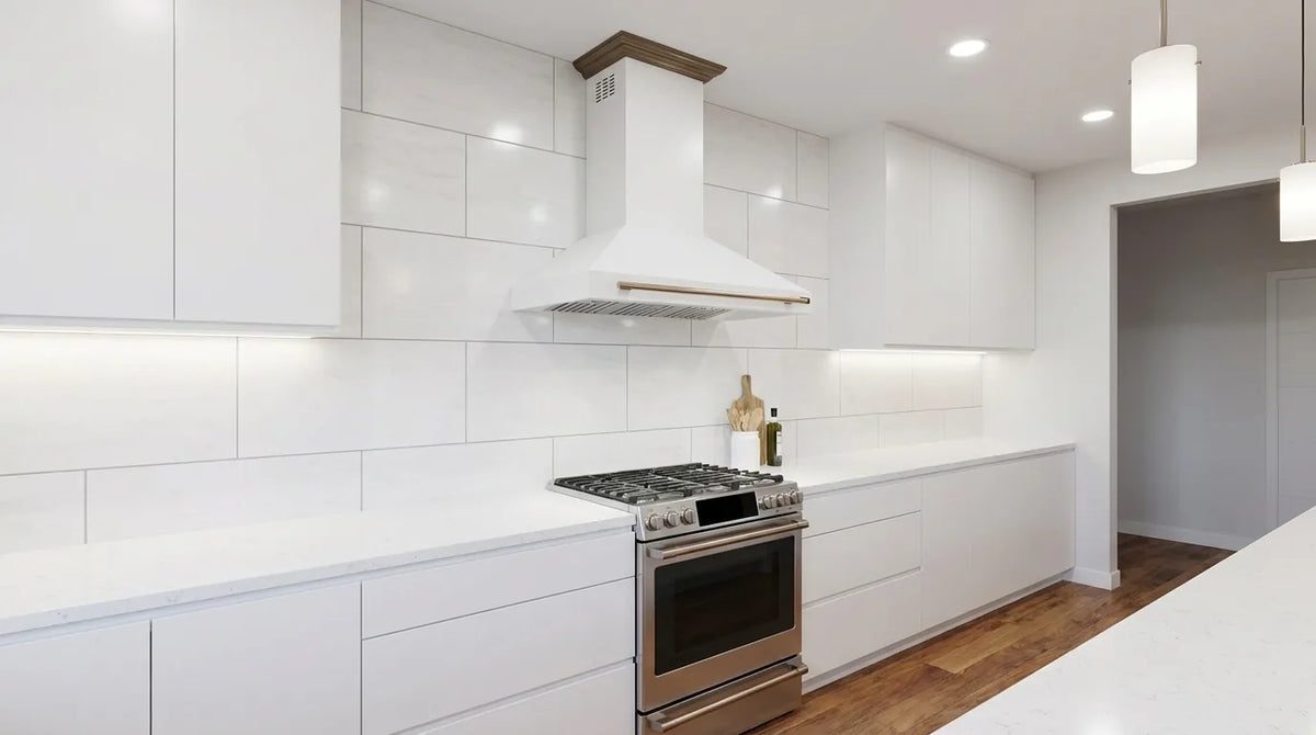 Forno Aria 48-Inch 1,200 CFM Wall Mount Range Hood in White with Antique Brass Trim shown in a styled kitchen