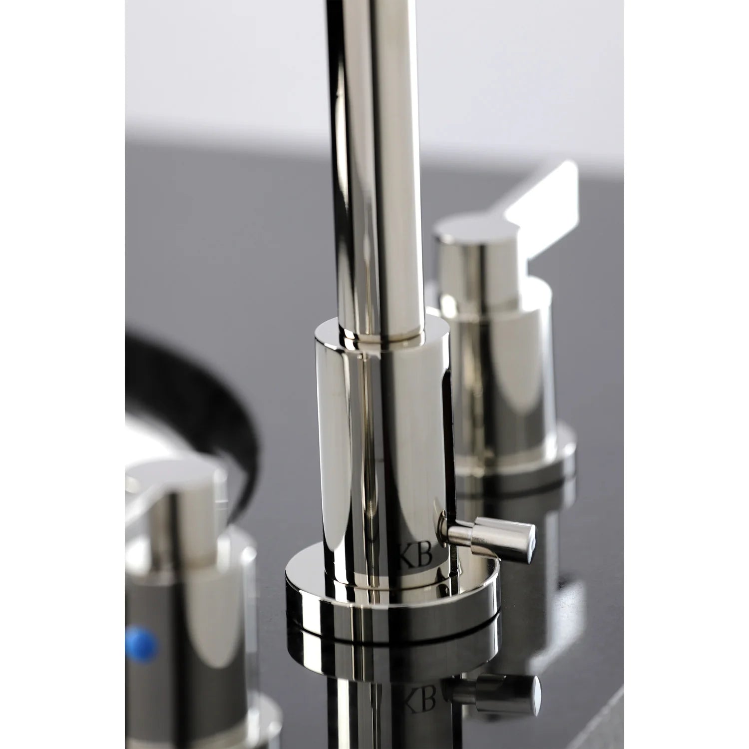 Polished nickel faucet handle controls with blue indicator dot and base trim