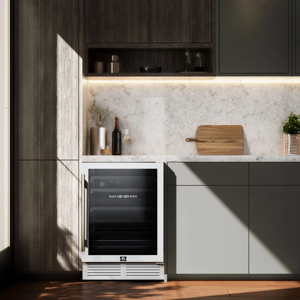 Forno Bachino 24-Inch Built-In or Freestanding Wine Cooler in White with Antique Brass Trim, with LED Lighting, Triple Glass Door, & 51 Bottle Capacity shown in a styled kitchen