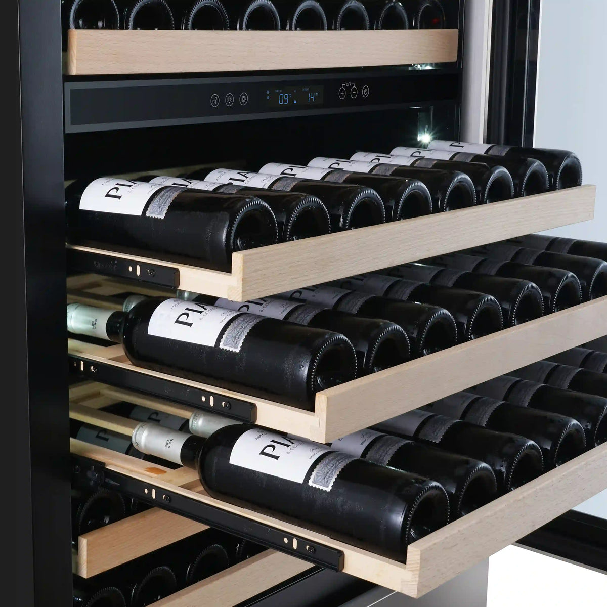 Interior of a dual-zone wine cooler with multiple shelves holding rows of wine bottles